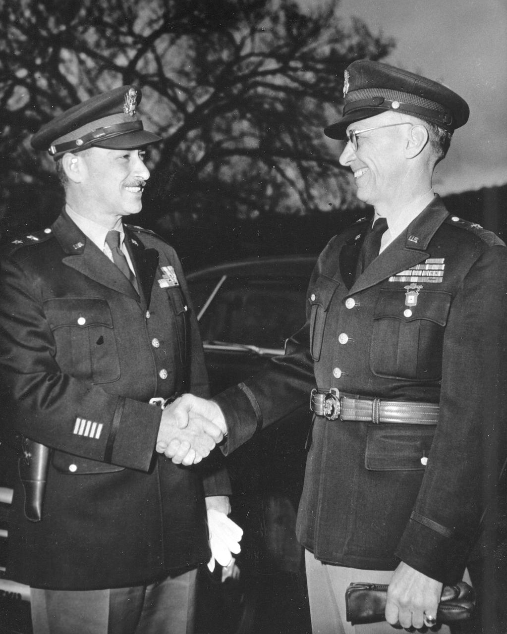 General Medaris, (left) who was a Commander of the Army Ballistic Missile Agency (ABMA) in Redstone Arsenal, Alabama, during 1955 to 1958, shakes hands with Major General Holger Toftoy (right), who consolidated U.S. missile and rocketry development.