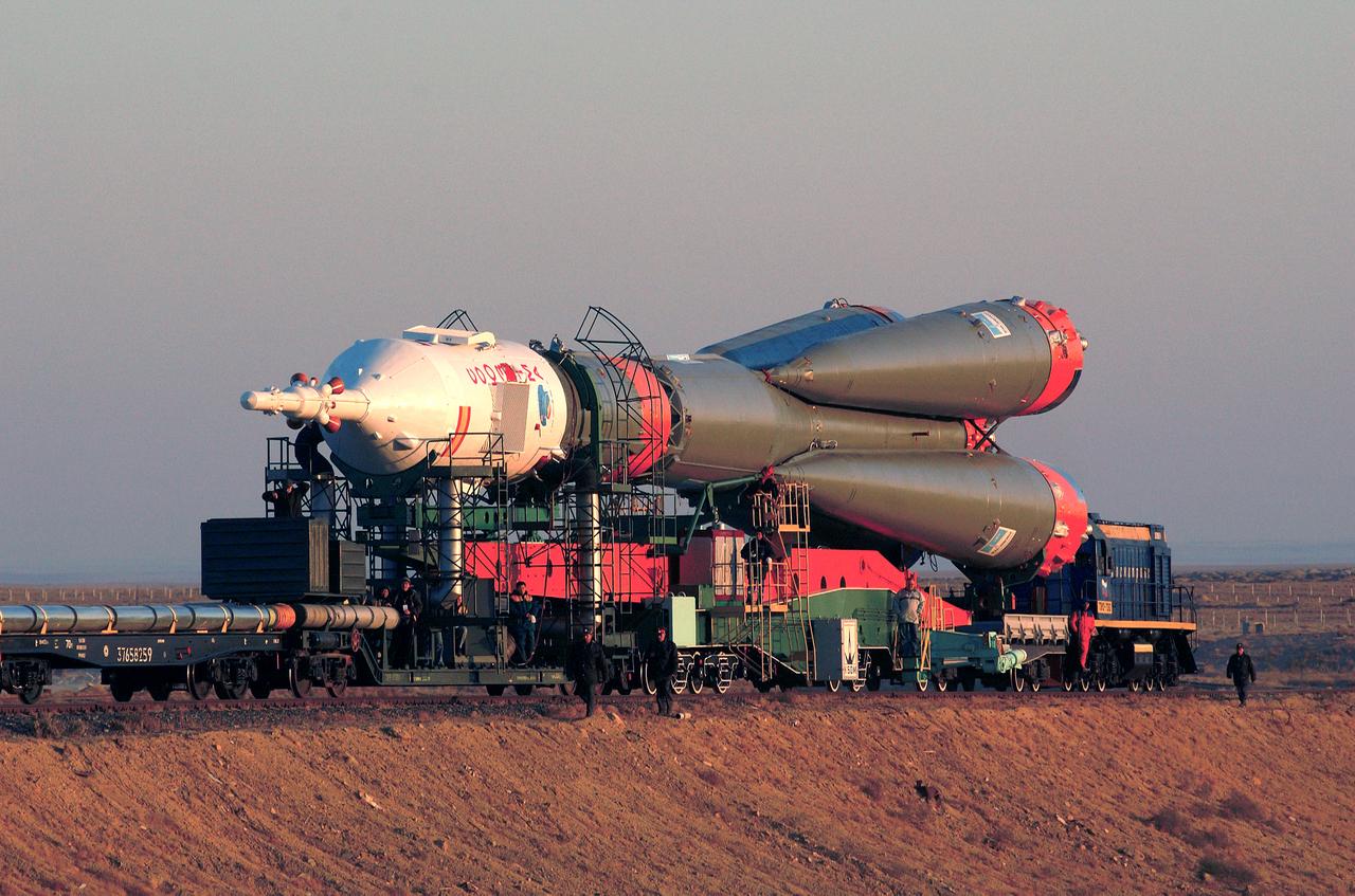 The Soyuz TMA-3 spacecraft and its booster rocket (front view) is shown on a rail car for transport to the launch pad where it was raised to a vertical launch position at the Baikonur Cosmodrome, Kazakhstan on October 16, 2003. Liftoff occurred on October 18th, transporting a three man crew to the International Space Station (ISS). Aboard were Michael Foale, Expedition-8 Commander and NASA science officer; Alexander Kaleri, Soyuz Commander and flight engineer, both members of the Expedition-8 crew; and European Space agency (ESA) Astronaut Pedro Duque of Spain. Photo Credit: "NASA/Bill Ingalls"