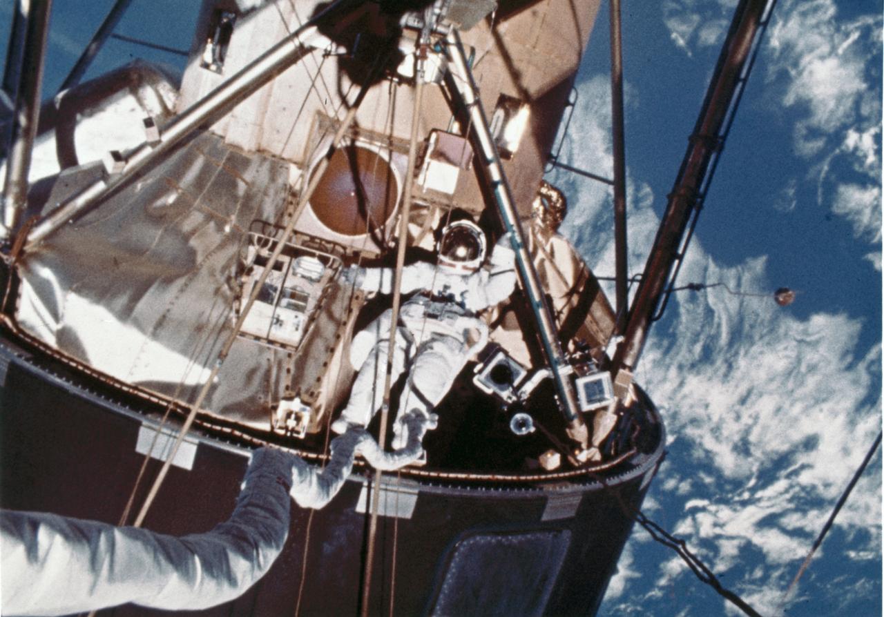 In this photograph, a skylab-4 astronaut performs Extra Vehicular Activities (EVA) outside of the lab. The third crew (Skylab-4) spent 84 days in the orbiting laboratory. The solar observatory was designed for full exposure to the Sun throughout most of the Skylab mission. Solar energy was transformed into electrical power for operation of all spacecraft systems. The proper operation of these solar arrays was vital to the mission.