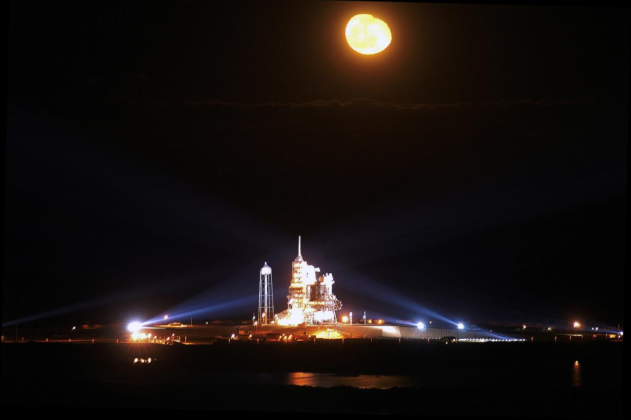 The Space Shuttle Endeavour is pictured on a lighted launch pad at Kennedy Space Center's (KSC) Launch Complex 39 with a gibbous moon shining brightly in the night sky. Liftoff from KSC occurred at 7:49:47 p.m. (EST), November 23, 2002. The launch is the 19th for Endeavour, and the 112th flight in the Shuttle program. Mission STS-113 is the 16th assembly flight to the International Space Station (ISS), carrying another structure for the Station, the P1 integrated truss. STS-113 crew members onboard were astronauts James D. Wetherbee, commander; Paul S. Lockhart, pilot, along with astronauts Michael E. Lopez-Alegria and John B. Herrington, both mission specialists. Also onboard were the Expedition 6 crew members: Astronauts Kenneth D. Bowersox and Donald R. Pettit, along with cosmonaut Nikolai M. Budarin, who went on to replace Expedition 5 aboard the Station.
