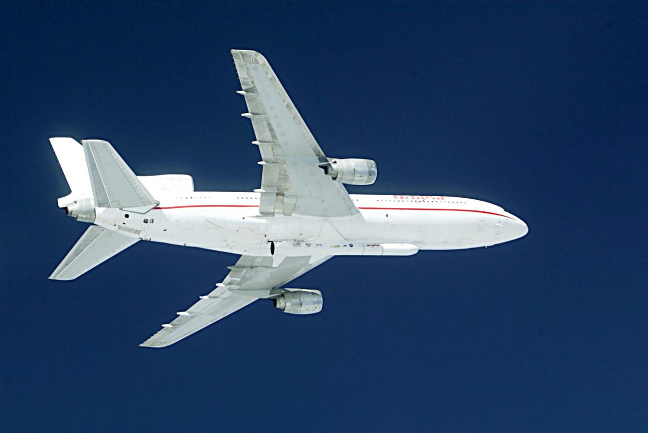 Orbital Sciences Corportation's L1011 prepares to release a Pegasus rocket, January 25, 2003, off the coast of Cape Canaveral, FL,  which will deliver the SORCE satellite, Solar Radiation and Climate Experiment, into the low-Earth orbit. The joint project with Orbital, NASA and the University of Colorado satellite is an atmospheric instrument that will measure incoming radiant energy from the sun. Scientists will use this to address long term atmospheric and climate changes. Other uses will be for ozone research and ultraviolet radiation. (Photo by Eric Roback and Rob Rivers, NASA Langley Research Center)