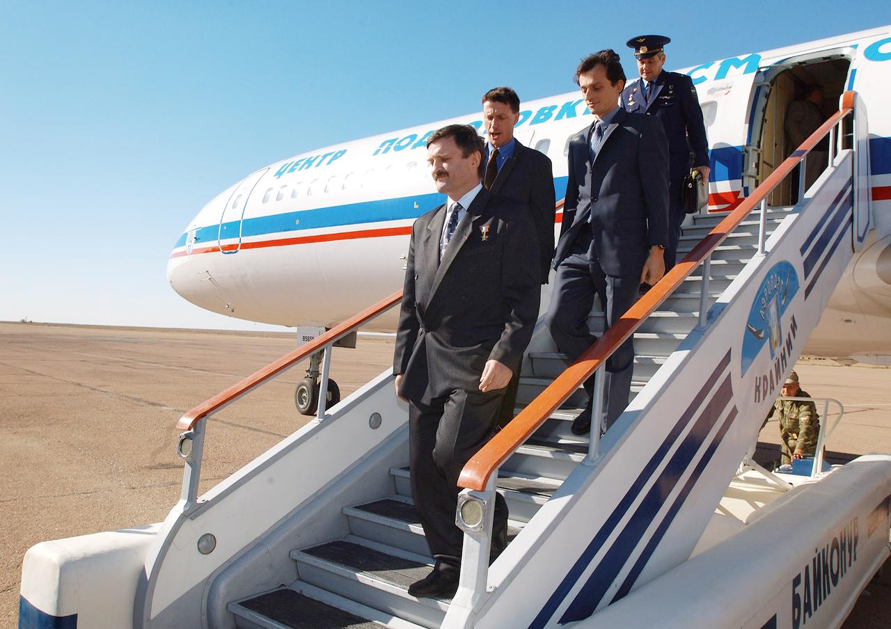 October 12, 2003, Baikonur, Kazakhstan.  (left to right) Expedition 8 Soyuz Commander and Flight Engineer Alexander Kaleri, Expedition 8 Commander Michael Foale, European Space Agency Astronaut Pedro Duque of Spain and Valery Korzun, Chief of Cosmonauts arrive in Baikonur.  Expedition 8 is scheduled to launch from the Baikonur Cosmodrome in Kazakhstan on October 18th onboard a Soyuz rocket to the International Space Station.  Photo Credit: "NASA/Bill Ingalls"