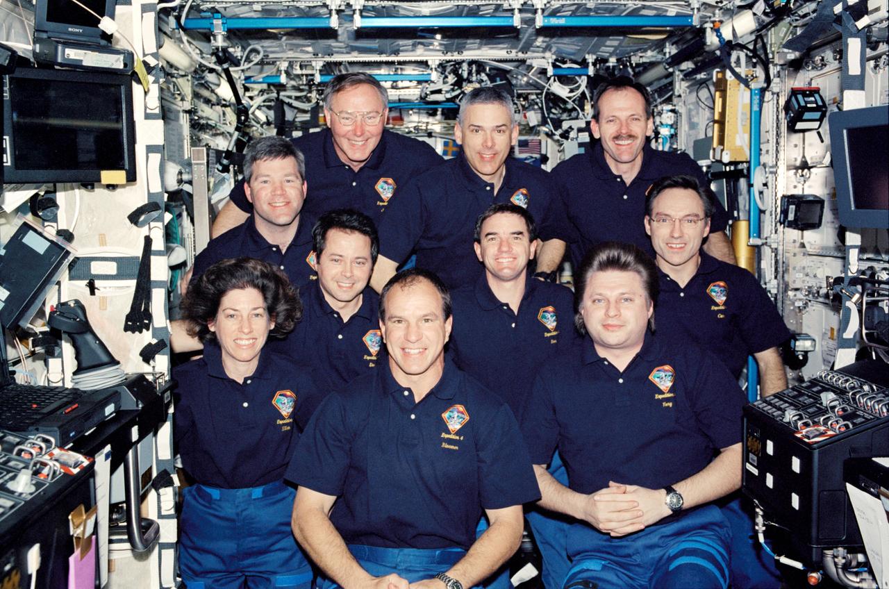 Posed inside the Destiny Laboratory aboard the International Space Station (ISS) are the STS-110 and Expedition Four crews for a traditional onboard portrait From the left, bottom row, are astronauts Ellen Ochoa, STS mission specialist, Michael J. Bloomfield, STS mission commander, and Yury I Onufrienko, Expedition Four mission commander. From the left, middle row, are astronauts Daniel W. Bursch, Expedition Four flight engineer, Rex J. Walheim, STS mission specialist, and Carl E. Walz, Expedition Four flight engineer. From the left, top row, are astronauts Stephen N. Frick, STS pilot; Jerry L. Ross, Lee M.E. Morin, and Steven L. Smith, all mission specialists. Launched aboard the Space Shuttle Orbiter Atlantis on April 8, 2002, the STS-110 mission crew prepared the ISS for future space walks by installing and outfitting the 43-foot-long Starboard side S0 truss and preparing the Mobile Transporter. The mission served as the 8th ISS assembly flight.