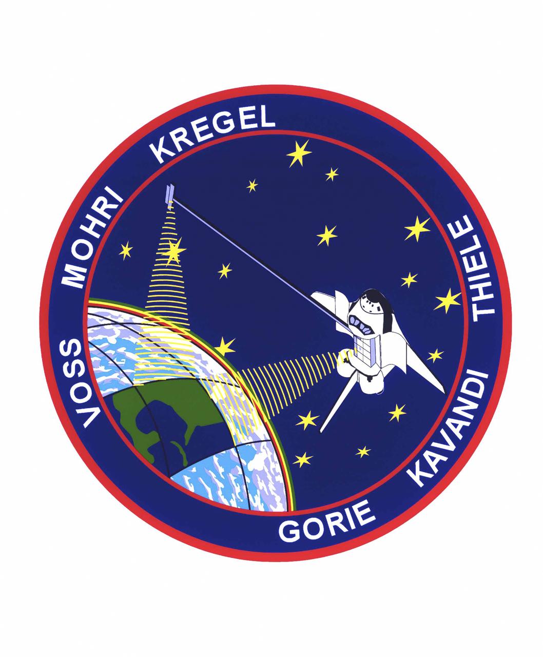 The STS-99 crew members designed the flight insignia for the Shuttle Radar Topography Mission (SRTM), the most ambitious Earth mapping mission to date. Two radar anternas, one located in the Shuttle bay and the other located on the end of a 60-meter deployable mast, was used during the mission to map Earth's features. The goal was to provide a 3-dimensional topographic map of the world's surface up to the Arctic and Antarctic Circles. In the patch, the clear portion of Earth illustrates the radar beams penetrating its cloudy atmosphere and the unique understanding of the home planet that is provided by space travel. The grid on Earth reflects the mapping character of the SRTM mission. The patch depicts the Space Shuttle Endeavour orbiting Earth in a star spangled universe. The rainbow along Earth's horizon resembles an orbital sunrise. The crew deems the bright colors of the rainbow as symbolic of the bright future ahead because of human beings' venturing into space. The crew of six launched aboard the Space Shuttle Endeavor on February 11, 2000 and completed 222 hours of around the clock radar mapping gathering enough information to fill more than 20,000 CDs.