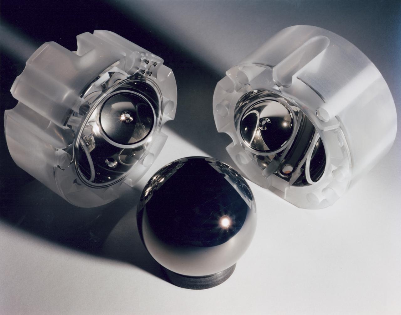 The Gravity Probe B (GP-B) is the relativity experiment developed at Stanford University to test two extraordinary predictions of Albert Einstein’s general theory of relativity. The experiment will measure, very precisely, the expected tiny changes in the direction of the spin axes of four gyroscopes contained in an Earth-orbiting satellite at a 400-mile altitude. So free are the gyroscopes from disturbance that they will provide an almost perfect space-time reference system. They will measure how space and time are very slightly warped by the presence of the Earth, and, more profoundly, how the Earth’s rotation very slightly drags space-time around with it. These effects, though small for the Earth, have far-reaching implications for the nature of matter and the structure of the Universe. This photograph is a close up of a niobium-coated gyroscope motor and its housing halves. GP-B is among the most thoroughly researched programs ever undertaken by NASA. This is the story of a scientific quest in which physicists and engineers have collaborated closely over many years. Inspired by their quest, they have invented a whole range of technologies that are already enlivening other branches of science and engineering.  Launched  April 20, 2004 , the GP-B program was managed for NASA by the Marshall Space Flight Center. Development of the GP-B is the responsibility of Stanford University along with major subcontractor Lockheed Martin Corporation.  (Image credit to Don Harley.)