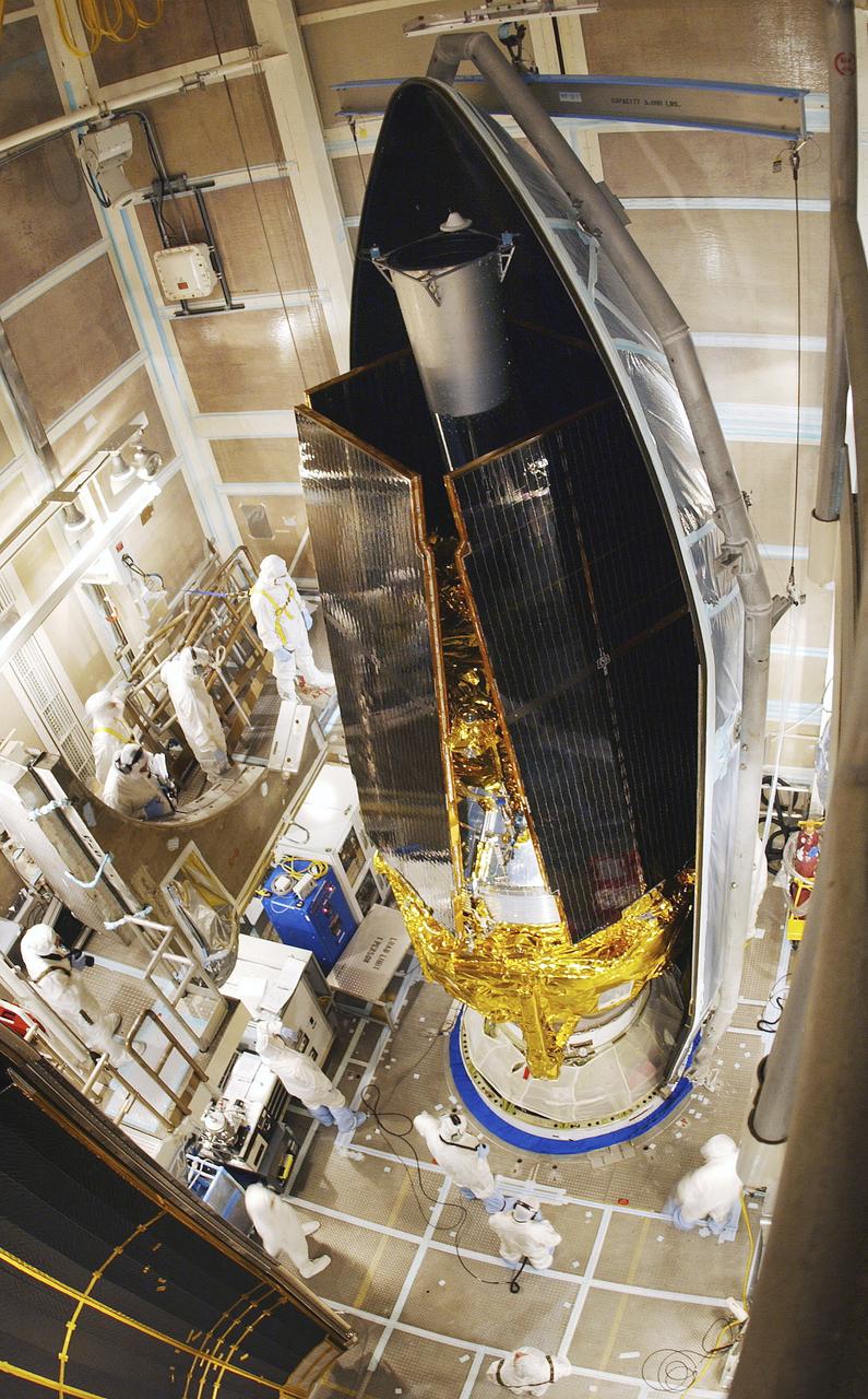 In this photo, the Gravity Probe B (GP-B) space vehicle is being encapsulated atop the Delta II launch vehicle. The GP-B is the relativity experiment developed at Stanford University to test two extraordinary predictions of Albert Einstein’s general theory of relativity. The experiment will measure, very precisely, the expected tiny changes in the direction of the spin axes of four gyroscopes contained in an Earth-orbiting satellite at a 400-mile altitude. So free are the gyroscopes from disturbance that they will provide an almost perfect space-time reference system. They will measure how space and time are very slightly warped by the presence of the Earth, and, more profoundly, how the Earth’s rotation very slightly drags space-time around with it. These effects, though small for the Earth, have far-reaching implications for the nature of matter and the structure of the Universe. GP-B is among the most thoroughly researched programs ever undertaken by NASA. This is the story of a scientific quest in which physicists and engineers have collaborated closely over many years. Inspired by their quest, they have invented a whole range of technologies that are already enlivening other branches of science and engineering.  Launched  April 20, 2004 , the GP-B program was managed for NASA by the Marshall Space Flight Center. Development of the GP-B is the responsibility of Stanford University along with major subcontractor Lockheed Martin Corporation.  (Image credit to Russ Underwood, Lockheed Martin Corporation).