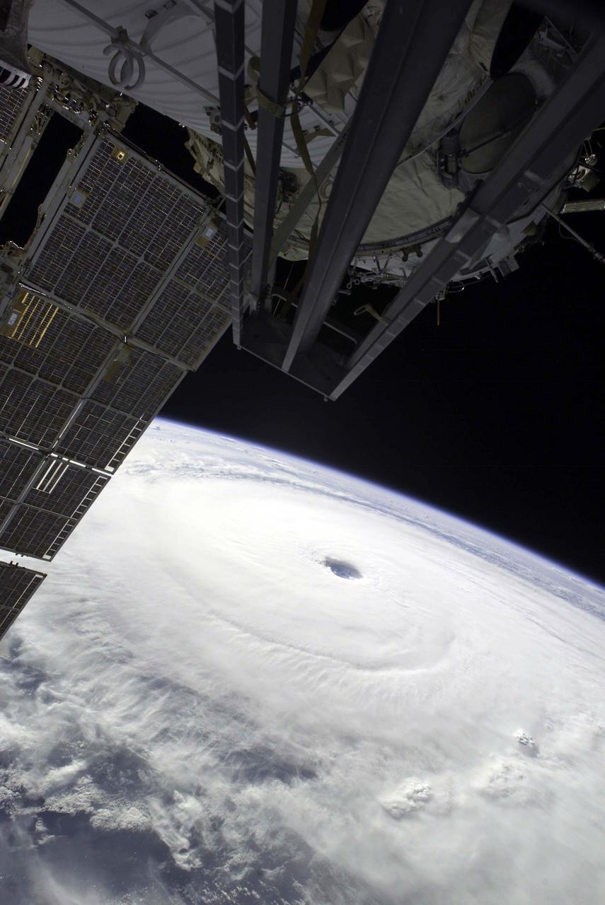 Except for a small portion of the International Space Station (ISS) in the foreground, Hurricane Ivan, one of the strongest hurricanes on record, fills this image over the northern Gulf of Mexico. As the downgraded category 4 storm approached landfall on the Alabama coast Wednesday afternoon on September 15, 2004, sustained winds in the eye of the wall were reported at about 135 mph. The hurricane was photographed by astronaut Edward M. (Mike) Fincke from aboard the ISS at an altitude of approximately 230 miles. Crew Earth Observations record Earth surface changes over time, as well as more fleeting events such as storms, floods, fires, and volcanic eruptions.