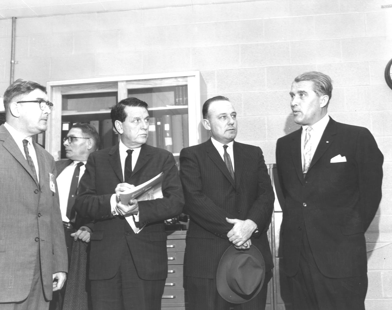 The members of the House Committee on Science and Astronautics visited the Marshall Space Flight Center (MSFC) on March 9, 1962 to gather firsthand information of the nation's space exploration program. The congressional group was composed of members of the Subcommittee on Manned Space Flight. They were briefed on MSFC's manned space efforts earlier in the day and then inspected mockups of the Saturn I Workshop and the Apollo Telescope Mount, two projects developed by MSFC for the post-Apollo program. Pictured left-to-right are Dieter Grau, MSFC; Konrad Dannenberg, MSFC; James G. Fulton, Republican representative for Pennsylvania; Joe Waggoner, Democratic representative for Louisiana; and Dr. Wernher von Braun, Director of MSFC.
