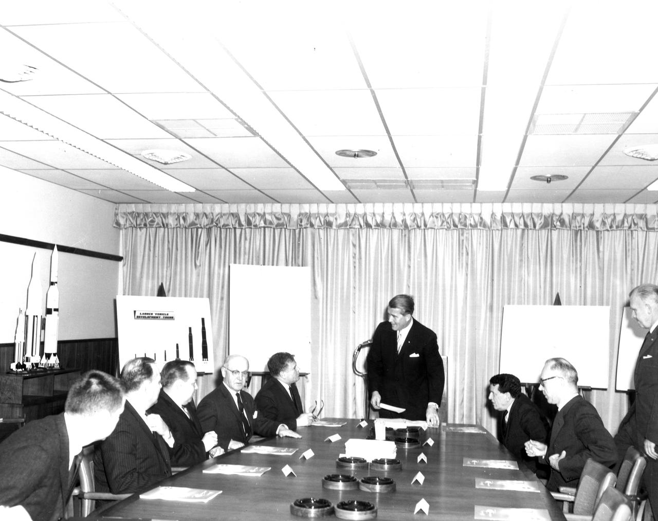 The members of the House Committee on Science and Astronautics visited the Marshall Space Flight Center (MSFC) on March 9, 1962 to gather firsthand information of the nation’s space exploration program. The congressional group was composed of members of the Subcommittee on Manned Space Flight.  The subcommittee was briefed on MSFC’s manned space efforts earlier in the day and then inspected mockups of the Saturn I Workshop and the Apollo Telescope Mount, two projects developed by MSFC for the post-Apollo program. In this photograph, MSFC Director, Dr. Wernher von Braun meets with Congressmen in the MSFC boardroom. Pictured from left to right are: Jack Cramer, NASA Headquarters; Joe Waggoner, Democratic representative of Louisiana; John W. Davis, Democratic representative of Georgia;  R. Walter Riehlman, Republican representative of New York; Olin E. Teague, Democratic representative of Texas; Dr. Wernher von Braun, Director of MSFC; James G. Fulton, Republican representative of Pennsylvania; Ken Hechler, Democratic representative of West Virginia; and Erich Neubert of MSFC.