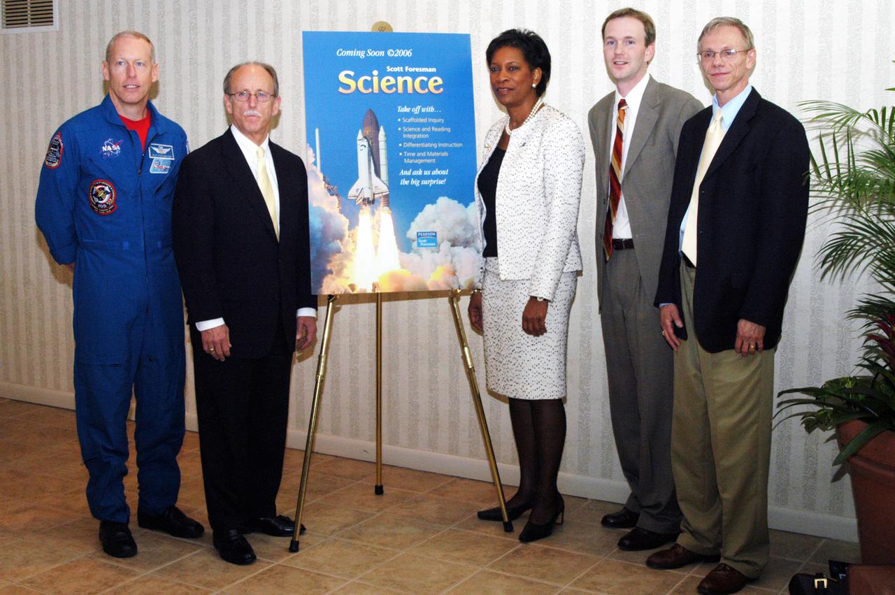 KENNEDY SPACE CENTER, FLA. - From left, NASA astronaut Patrick Forrester; Paul McFall, president, Pearson Scott Foresman; Dr. Adena Williams Loston, NASA chief education officer; James Lippe, science product manager, Pearson Scott Foresman; and Carl Benoit, senior national science consultant, Pearson Scott Foresman, participate in the unveiling of 'The Science in Space Challenge' at the Doubletree Hotel in Orlando, Fla. The national challenge program is sponsored by NASA and Pearson Scott Foresman, publisher of pre-K through grade six educational books. To participate in the challenge, teachers may submit proposals, on behalf of their students, for a science and technology investigation. Astronauts will conduct the winning projects on a Space Shuttle mission or on the International Space Station, while teachers and students follow along via television or the Web. For more information about the announcement, see the news release at http:__www.nasa.gov_home_hqnews_2004_oct_HQ_04341_publication.html.