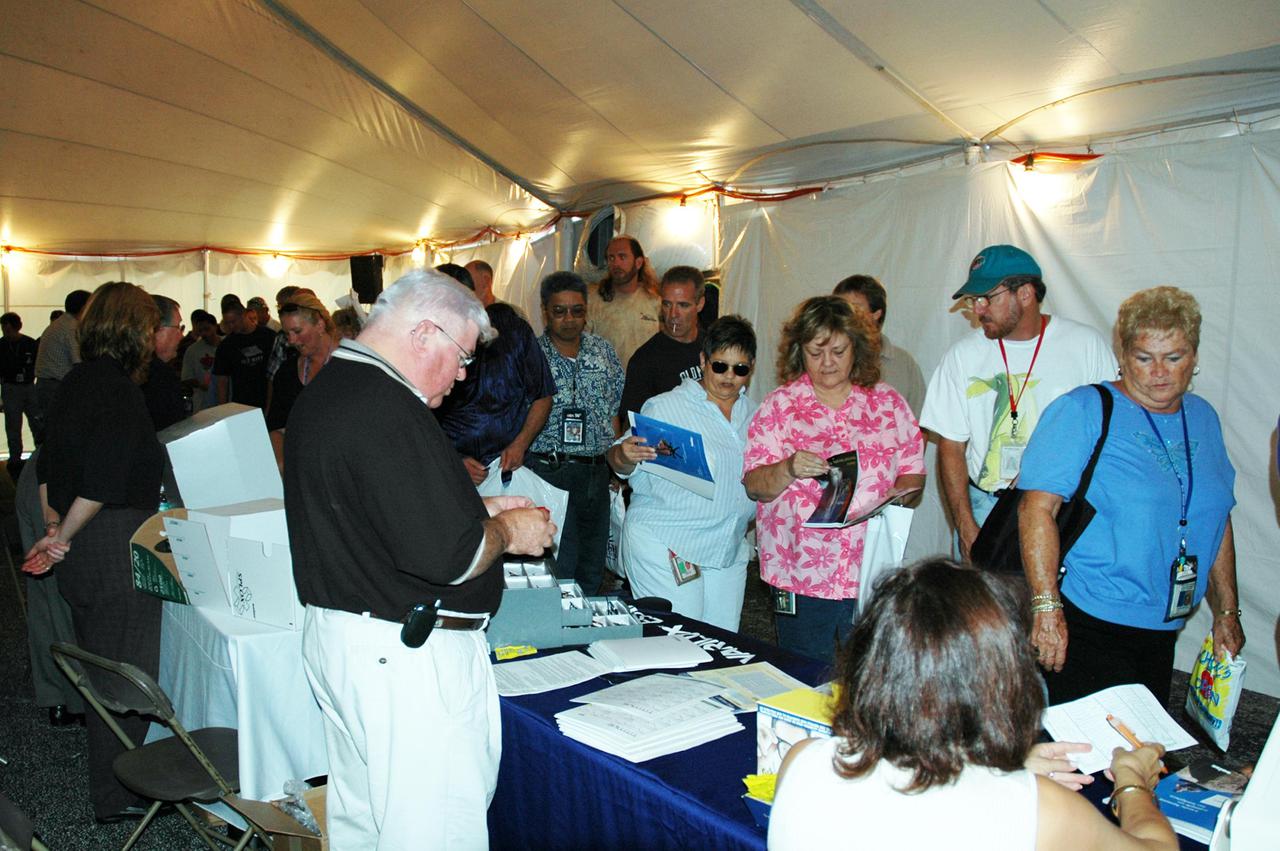KENNEDY SPACE CENTER, FLA. -   Employees at KSC walk through a tent filled with vendors’ exhibits during Spaceport Super Safety and Health Day. Vendors’ exhibits were set up in the parking areas outside the Vehicle Assembly Building and the OandC Building. The day-long event also featured presentations by guest speakers Dr. Pamela Peeke, Navy Com. Stephen E. Iwanowicz, NASA’s Dr. Kristine Calderon and Olympic-great Bruce Jenner.   Super Safety and Health Day was initiated at KSC in 1998 to increase awareness of the importance of safety and health among the government and contractor workforce.  The theme for this year’s event was “Safety and Health: A Winning Combination.”
