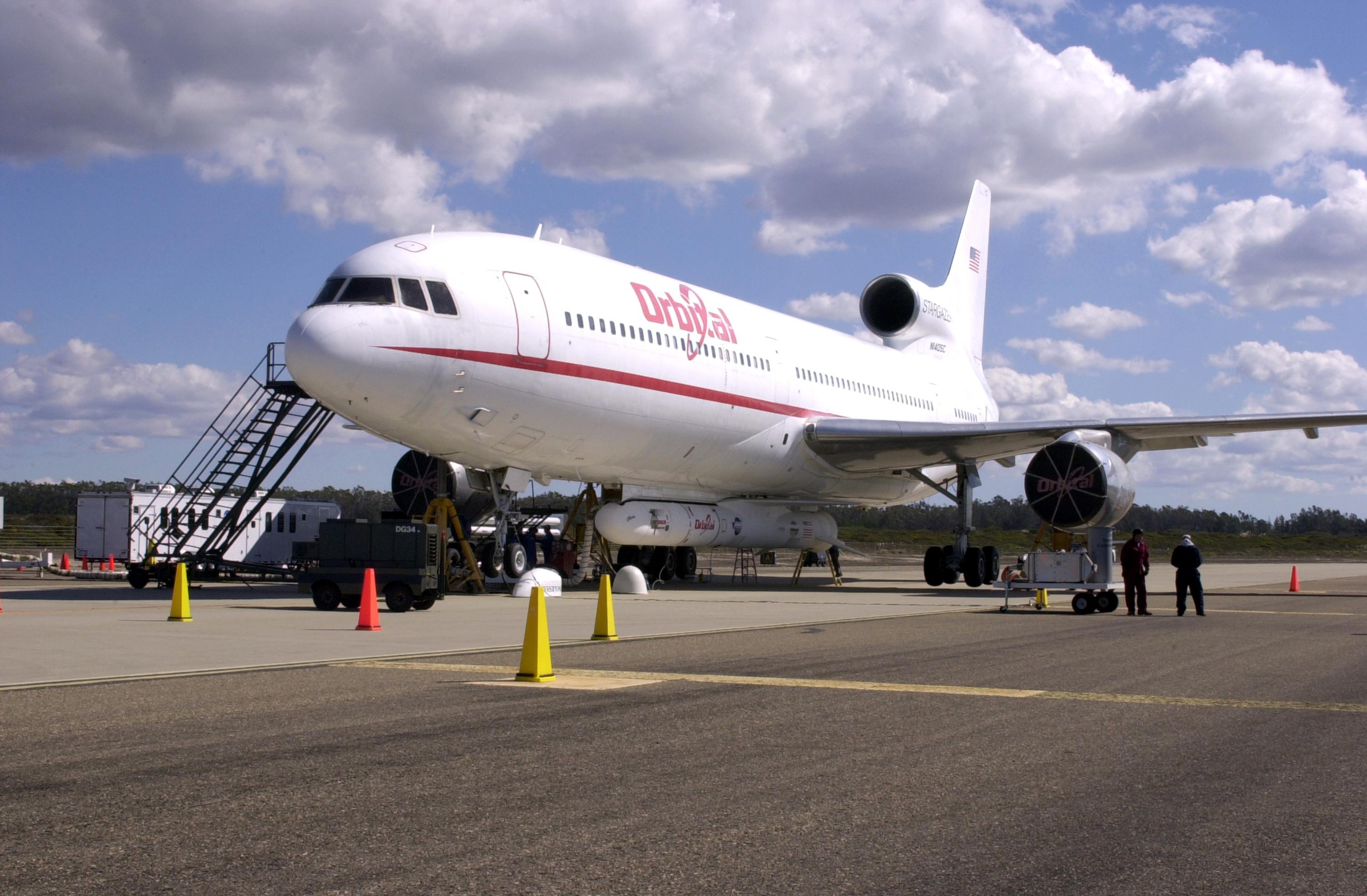 KENNEDY SPACE CENTER, FLA. - At Vandenberg Air Force Base in California, Orbital Sciences Corporation’s Stargazer L-1011 aircraft is ready for flight with the Demonstration of Autonomous Rendezvous Technology (DART) spacecraft and Orbital Sciences Pegasus launch vehicle attached underneath. The Pegasus XL will launch DART at approximately 40,000 feet above the Pacific Ocean into a circular polar orbit of approximately 475 miles. DART was designed and built for NASA by Orbital Sciences as an advanced flight demonstrator to locate and maneuver near an orbiting satellite. The DART spacecraft weighs about 800 pounds and is nearly 6 feet long and 3 feet in diameter. The DART satellite provides a key step in establishing autonomous rendezvous capabilities for the U.S. Space Program. While previous rendezvous and docking efforts have been piloted by astronauts, the unmanned DART satellite will have computers and cameras to perform its rendezvous functions.