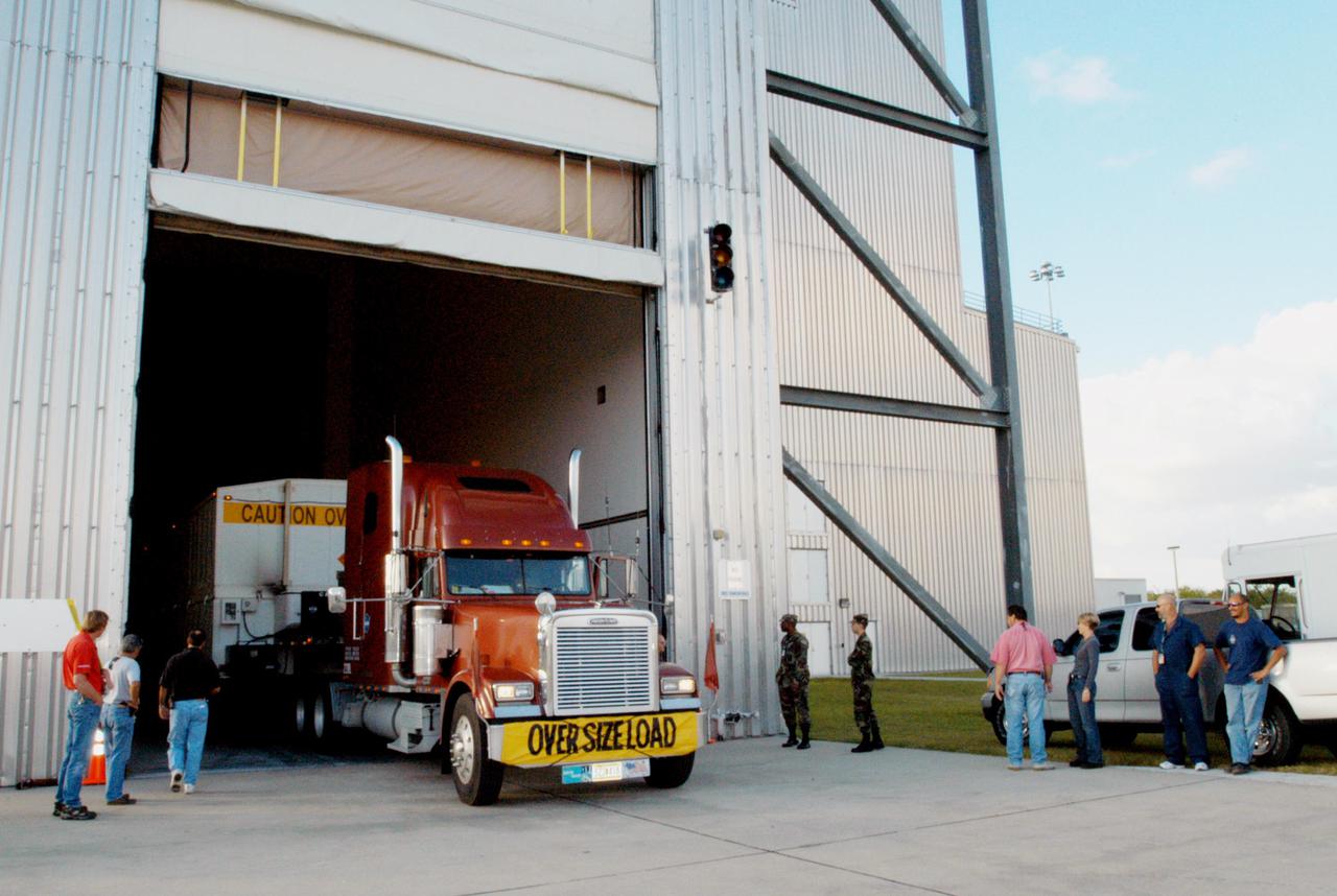 KENNEDY SPACE CENTER, FLA. - A truck carrying the second stage of a Boeing Delta IV launch vehicle delivers its cargo to the Boeing Delta Operations Center. The Delta IV rocket will be used for the 2005 launching of the GOES-N weather satellite for NASA and NOAA (National Oceanic and Atmospheric Administration). The first in a series of three advanced weather satellites including GOES-O and GOES-P, the GOES-N will provide continuous monitoring necessary for intensive data analysis. It will provide a constant vigil for the atmospheric “triggers” of severe weather conditions such as tornadoes, flash floods, hail storms and hurricanes. When these conditions develop, GOES-N will be able to monitor storm development and track their movements.