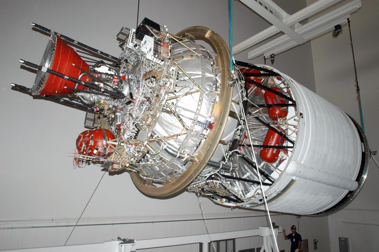 KENNEDY SPACE CENTER, FLA. - At the Boeing Delta Operations Center, the suspended second stage of a Boeing Delta IV launch vehicle is moved toward a work stand. The Delta IV rocket will be used for the 2005 launching of the GOES-N weather satellite for NASA and NOAA (National Oceanic and Atmospheric Administration). The first in a series of three advanced weather satellites including GOES-O and GOES-P, the GOES-N will provide continuous monitoring necessary for intensive data analysis. It will provide a constant vigil for the atmospheric “triggers” of severe weather conditions such as tornadoes, flash floods, hail storms and hurricanes. When these conditions develop, GOES-N will be able to monitor storm development and track their movements.
