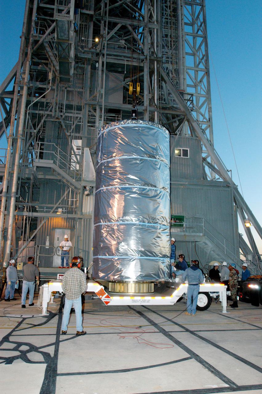 KENNEDY SPACE CENTER, FLA. -  Wrapped inside a protective cover, the Swift spacecraft arrives at Launch Pad 17-A on Cape Canaveral Air Force Station in Florida.  Swift is scheduled to launch Nov. 17. The liftoff aboard a Boeing Delta II rocket is targeted at the opening of a one-hour launch window beginning at 12:09 p.m. EST.  A first-of-its-kind multi-wavelength observatory dedicated to the study of gamma-ray burst (GRB) science, Swift’s three instruments will work together to observe GRBs and afterglows in the gamma ray, X-ray, ultraviolet and optical wavebands. Gamma-ray bursts are distant, yet fleeting explosions that appear to signal the births of black holes.