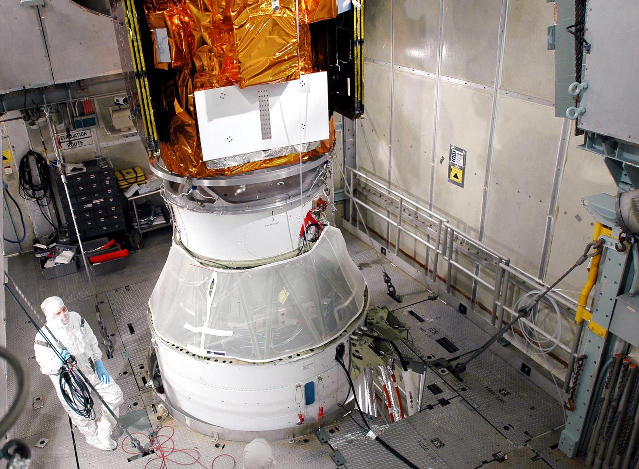 KENNEDY SPACE CENTER, FLA. - Inside the mobile service tower on Launch Pad 17-A, Cape Canaveral Air Force Station, the Swift spacecraft (on top) is ready for fairing encapsulation. On the bottom is the second stage of the Boeing Delta II launch vehicle. The fairing is being installed around the payload for protection during launch and ascent. A Boeing Delta II rocket is the launch vehicle for the Swift spacecraft and its Gamma-Ray Burst Mission. Swift is a first-of-its-kind multi-wavelength observatory dedicated to the study of gamma-ray burst science. Its three instruments will work together to observe GRBs and afterglows in the gamma ray, X-ray, ultraviolet and optical wavebands. Swift is scheduled to launch Nov. 17 at 12:09 p.m. EST.