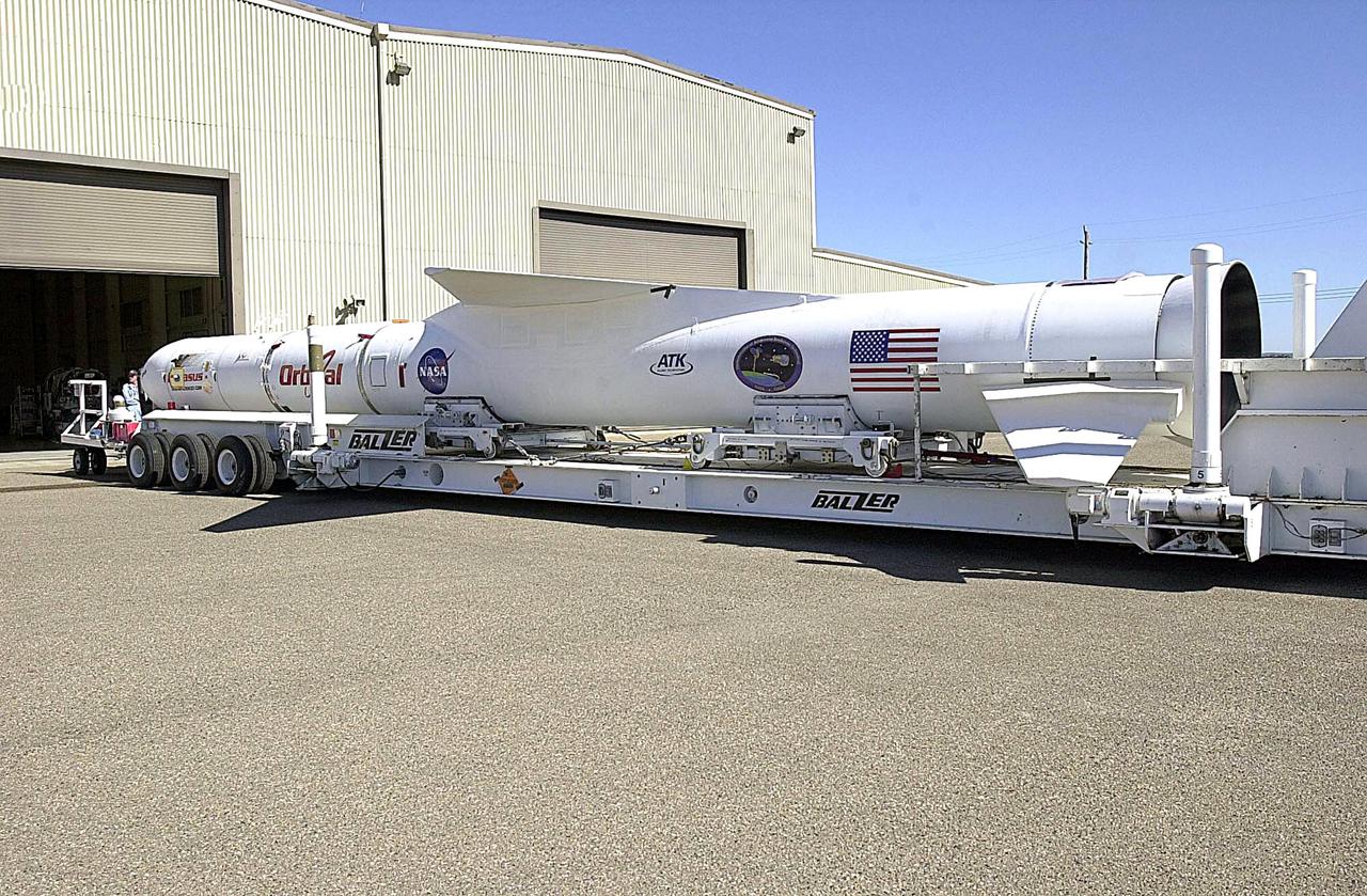 KENNEDY SPACE CENTER, FLA. - The Orbital Sciences Pegasus XL launch vehicle and Demonstration of Autonomous Rendezvous Technology (DART) spacecraft roll out of the hangar at Vandenberg Air Force Base in California. They will head to the runway and be attached to the underbelly of the Orbital Sciences L-1011 aircraft for launch Nov. 9. DART was designed and built for NASA by Orbital Sciences as an advanced flight demonstrator to locate and maneuver near an orbiting satellite. The DART spacecraft weighs about 800 pounds and is nearly 6 feet long and 3 feet in diameter. The Pegasus XL vehicle will launch DART into a circular polar orbit of approximately 475 miles. Once in orbit, DART will make contact with a target satellite, the Multiple Paths, Beyond-Line-of-Sight Communications (MUBLCOM), also built by Orbital Sciences and launched in 1999. DART will then perform several close-proximity operations, such as moving toward and away from the satellite using navigation data provided by on-board sensors. The entire mission will last only 24 hours and will be accomplished without human intervention. The DART flight computer will determine its own path to accomplish its mission objectives.