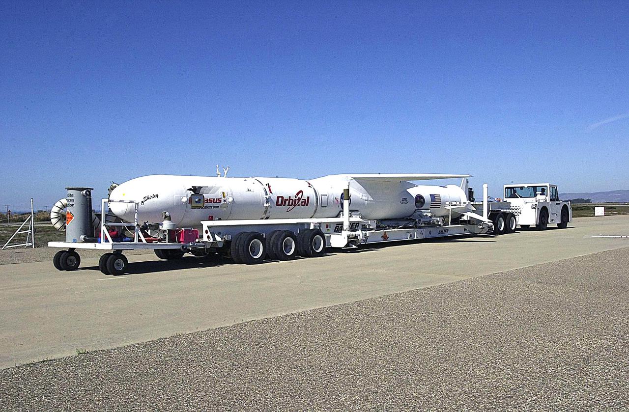 KENNEDY SPACE CENTER, FLA. - The Orbital Sciences Pegasus XL launch vehicle and Demonstration of Autonomous Rendezvous Technology (DART) spacecraft head for the runway at Vandenberg Air Force Base in California and the waiting Orbital Sciences L-1011 aircraft. The Pegasus_DART will be attached to the underbelly of the L-1011 for launch Nov. 9. DART was designed and built for NASA by Orbital Sciences as an advanced flight demonstrator to locate and maneuver near an orbiting satellite. The DART spacecraft weighs about 800 pounds and is nearly 6 feet long and 3 feet in diameter. The Pegasus XL vehicle will launch DART into a circular polar orbit of approximately 475 miles. Once in orbit, DART will make contact with a target satellite, the Multiple Paths, Beyond-Line-of-Sight Communications (MUBLCOM), also built by Orbital Sciences and launched in 1999. DART will then perform several close-proximity operations, such as moving toward and away from the satellite using navigation data provided by on-board sensors. The entire mission will last only 24 hours and will be accomplished without human intervention. The DART flight computer will determine its own path to accomplish its mission objectives.