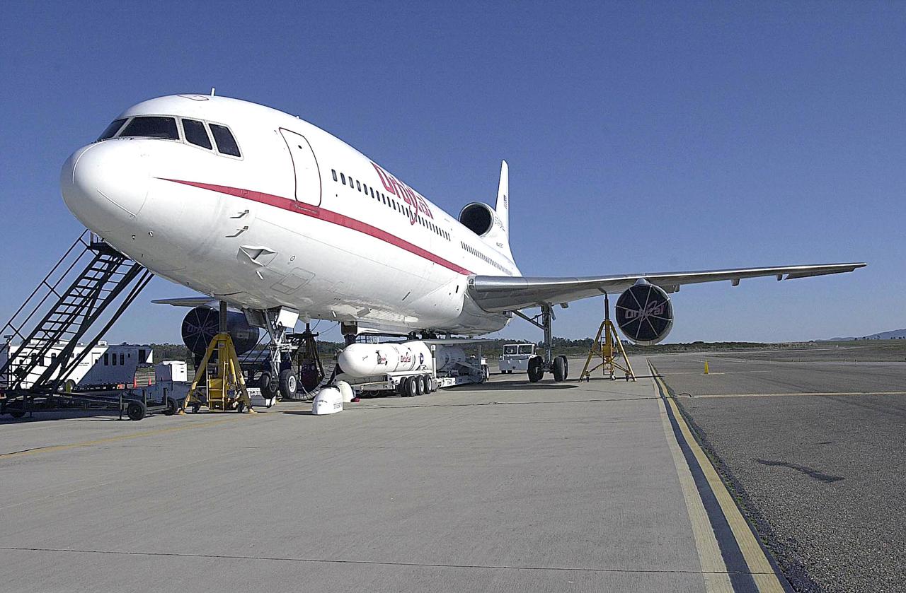 KENNEDY SPACE CENTER, FLA. - At Vandenberg Air Force Base in California, the Orbital Sciences Pegasus XL launch vehicle and Demonstration of Autonomous Rendezvous Technology (DART) spacecraft, which are mated, are being attached to the underbelly of the Orbital Sciences L-1011 aircraft for launch Nov. 9. DART was designed and built for NASA by Orbital Sciences as an advanced flight demonstrator to locate and maneuver near an orbiting satellite. The DART spacecraft weighs about 800 pounds and is nearly 6 feet long and 3 feet in diameter. The Pegasus XL vehicle will launch DART into a circular polar orbit of approximately 475 miles. Once in orbit, DART will make contact with a target satellite, the Multiple Paths, Beyond-Line-of-Sight Communications (MUBLCOM), also built by Orbital Sciences and launched in 1999. DART will then perform several close-proximity operations, such as moving toward and away from the satellite using navigation data provided by on-board sensors. The entire mission will last only 24 hours and will be accomplished without human intervention. The DART flight computer will determine its own path to accomplish its mission objectives.