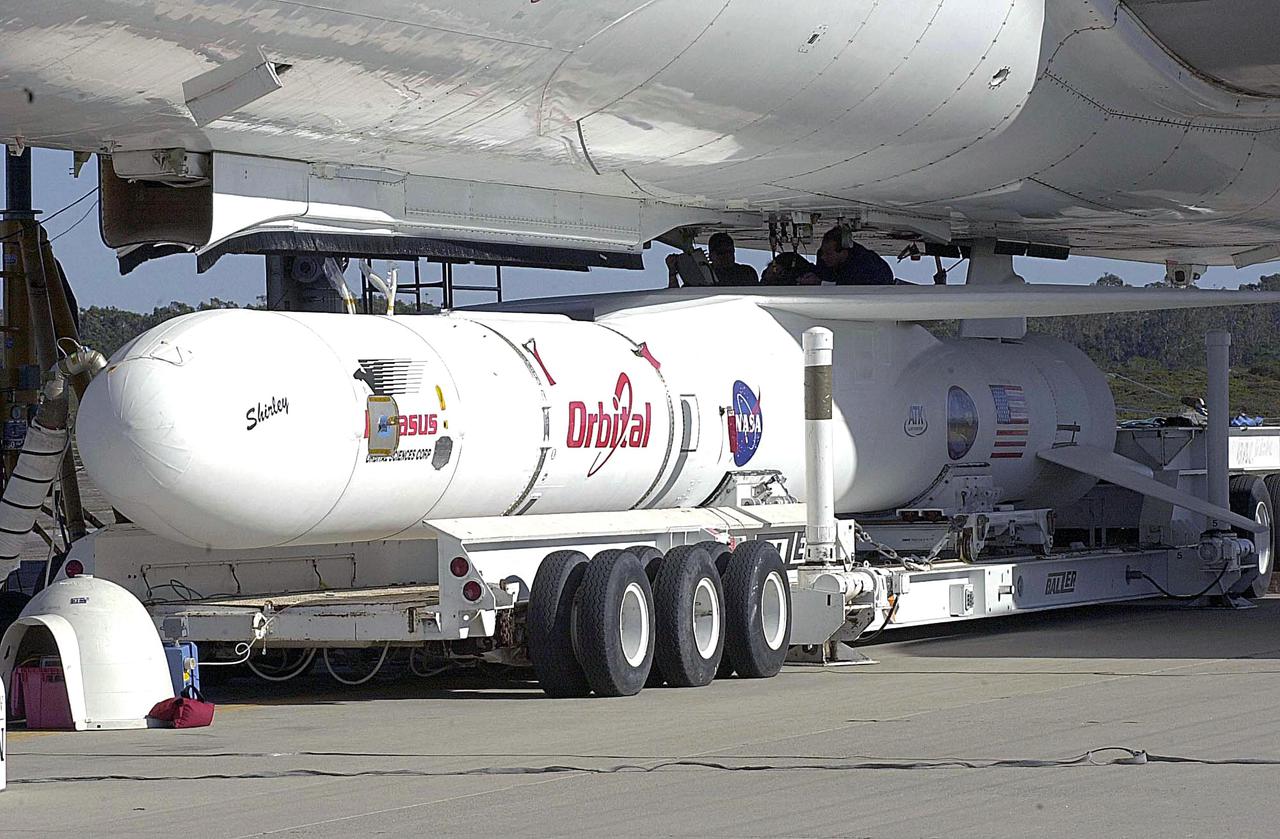 KENNEDY SPACE CENTER, FLA. - At Vandenberg Air Force Base in California, the Orbital Sciences Pegasus XL launch vehicle and Demonstration of Autonomous Rendezvous Technology (DART) spacecraft, which are mated, are being attached to the underbelly of the Orbital Sciences L-1011 aircraft for launch Nov. 9. DART was designed and built for NASA by Orbital Sciences as an advanced flight demonstrator to locate and maneuver near an orbiting satellite. The DART spacecraft weighs about 800 pounds and is nearly 6 feet long and 3 feet in diameter. The Pegasus XL vehicle will launch DART into a circular polar orbit of approximately 475 miles. Once in orbit, DART will make contact with a target satellite, the Multiple Paths, Beyond-Line-of-Sight Communications (MUBLCOM), also built by Orbital Sciences and launched in 1999. DART will then perform several close-proximity operations, such as moving toward and away from the satellite using navigation data provided by on-board sensors. The entire mission will last only 24 hours and will be accomplished without human intervention. The DART flight computer will determine its own path to accomplish its mission objectives.