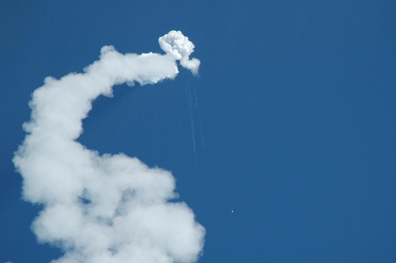 KENNEDY SPACE CENTER, FLA. -   The Solid Rocket Boosters of the Boeing Delta II rocket, used to launch NASA’s Swift spacecraft, fall toward the Atlantic Ocean as the rocket continues on its path down range.  The successful launch took place at Complex 17A at Cape Canaveral Air Force Station on Nov. 20 at 12:16:00.611 p.m. EST.  Swift is a first-of-its-kind multi-wavelength observatory dedicated to the study of gamma-ray burst science. Its three instruments will work together to observe GRBs and afterglows in the gamma ray, X-ray, ultraviolet and optical wavebands.