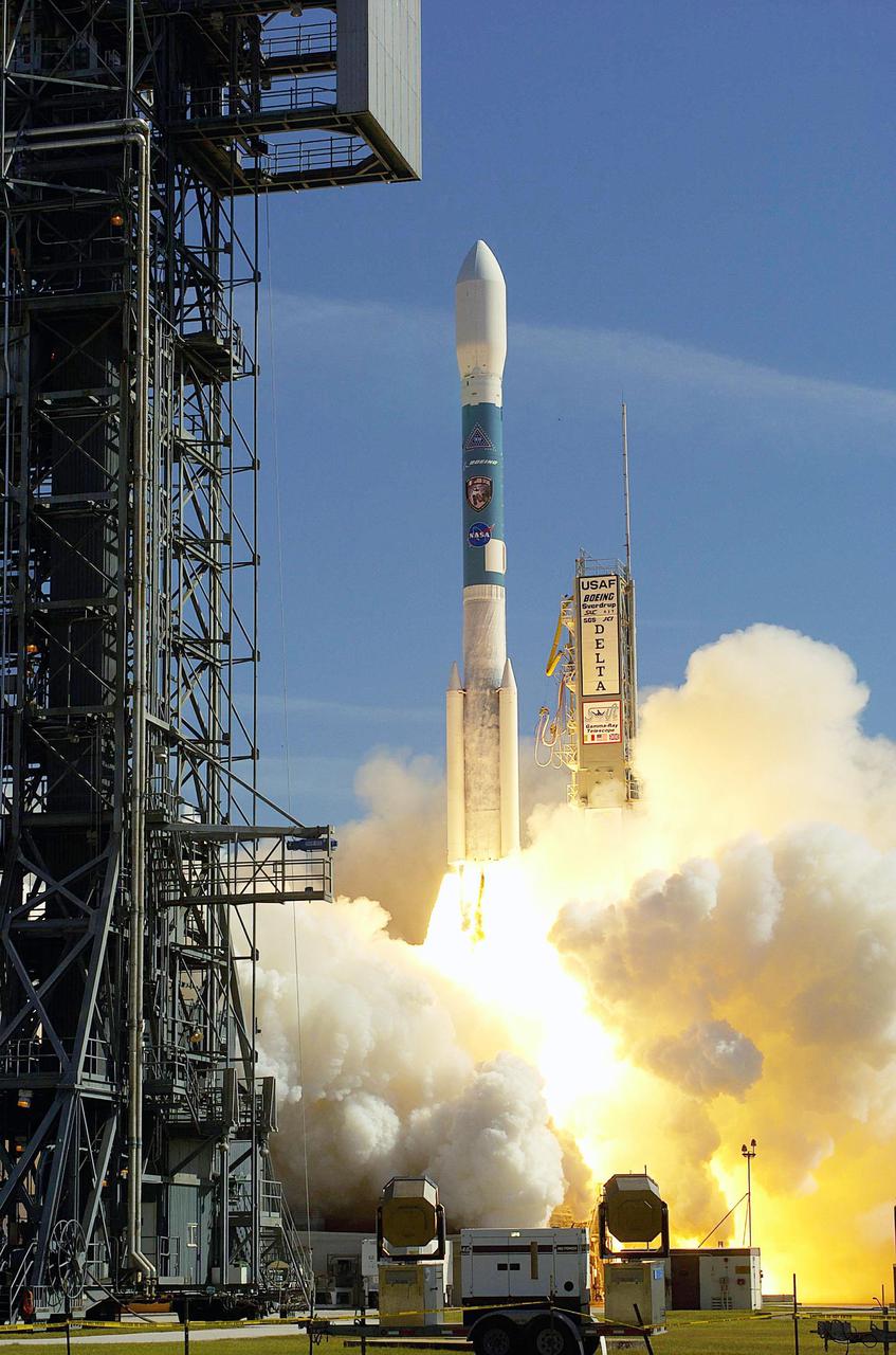 KENNEDY SPACE CENTER, FLA. -   Clouds of exhaust form around a Boeing Delta II expendable launch vehicle as it blasts NASA’s Swift spacecraft on its mission from Complex 17-A, Cape Canaveral Air Force Station, at 12:16:00.611 p.m. EST Nov. 20 . Swift is a first-of-its-kind multi-wavelength observatory dedicated to the study of gamma-ray burst science. Its three instruments will work together to observe GRBs and afterglows in the gamma ray, X-ray, ultraviolet and optical wavebands.  [Photo courtesy of Scott Andrews]