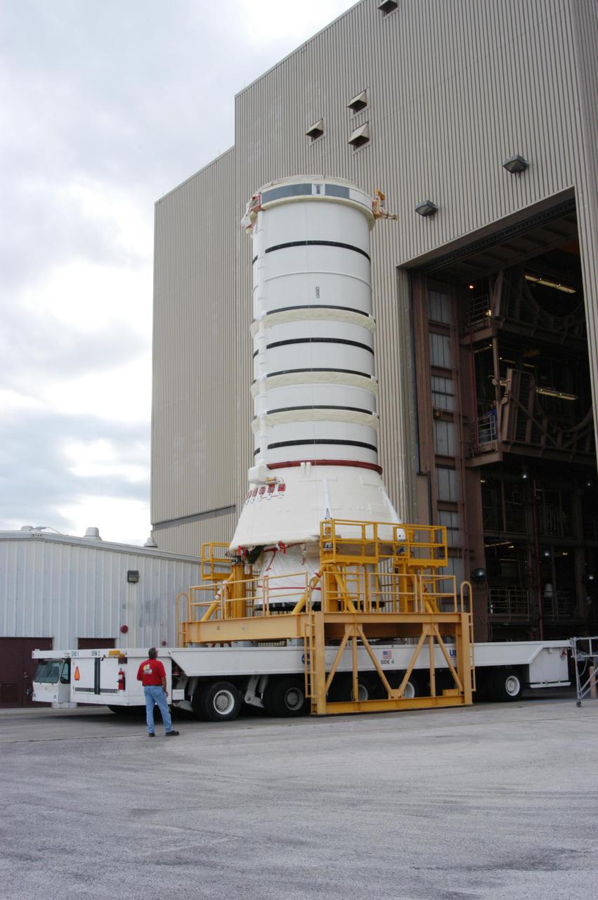 KENNEDY SPACE CENTER, FLA. -   The aft skirt and lower segment of the Solid Rocket Booster (SRB) being prepared for Return to Flight on mission STS-114 leave the Rotation Processing and Surge Facility.  The segments are being transported to the Vehicle Assembly Building where they will be prepared for stacking with the other segments arriving later.  Two SRBs support the liftoff of the Space Shuttle on a launch.  The twin 149-foot tall, 12-foot diameter SRBs provide the main propulsion system during launch to place the 180,000-pound orbiters in the proper orbit around the Earth.  They operate parallel with the Space Shuttle main engines for the first two minutes of flight and jettison away from the orbiter with help from the Booster Separation Motors, about 26.3 nautical miles above the Earth’s surface.