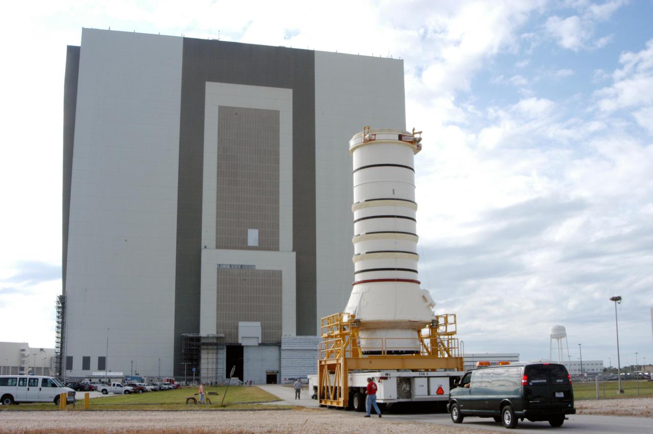 KENNEDY SPACE CENTER, FLA. -   The aft skirt and lower segment of the Solid Rocket Booster (SRB) being prepared for Return to Flight on mission STS-114 approach the Vehicle Assembly Building.  The segments will be prepared for stacking with the other segments arriving later. Two SRBs support the liftoff of the Space Shuttle on a launch.  The twin 149-foot tall, 12-foot diameter SRBs provide the main propulsion system during launch to place the 180,000-pound orbiters in the proper orbit around the Earth.  They operate parallel with the Space Shuttle main engines for the first two minutes of flight and jettison away from the orbiter with help from the Booster Separation Motors, about 26.3 nautical miles above the Earth’s surface.
