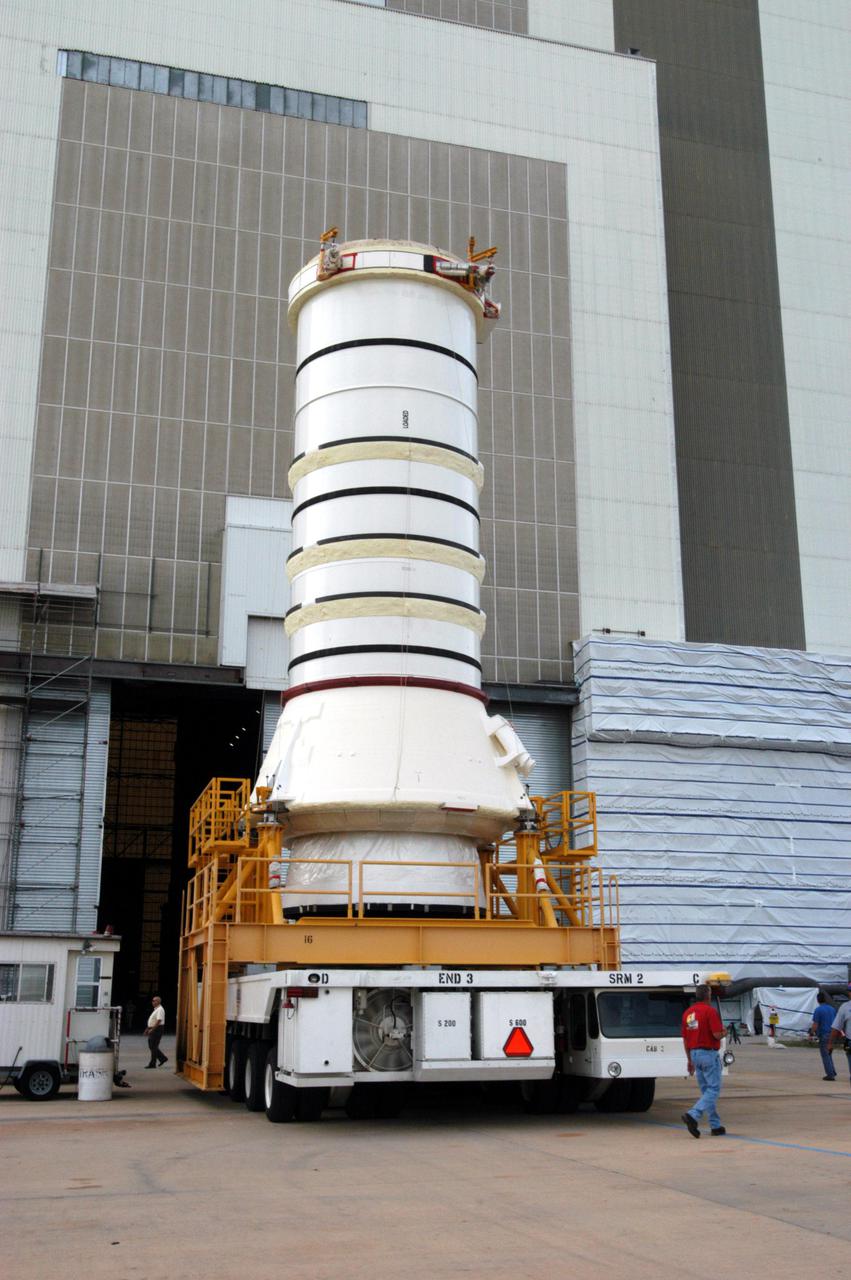KENNEDY SPACE CENTER, FLA. -   The aft skirt and lower segment of the Solid Rocket Booster (SRB) being prepared for Return to Flight on mission STS-114 approach the Vehicle Assembly Building.  The segments will be prepared for stacking with the other segments arriving later. Two SRBs support the liftoff of the Space Shuttle on a launch.  The twin 149-foot tall, 12-foot diameter SRBs provide the main propulsion system during launch to place the 180,000-pound orbiters in the proper orbit around the Earth.  They operate parallel with the Space Shuttle main engines for the first two minutes of flight and jettison away from the orbiter with help from the Booster Separation Motors, about 26.3 nautical miles above the Earth’s surface.