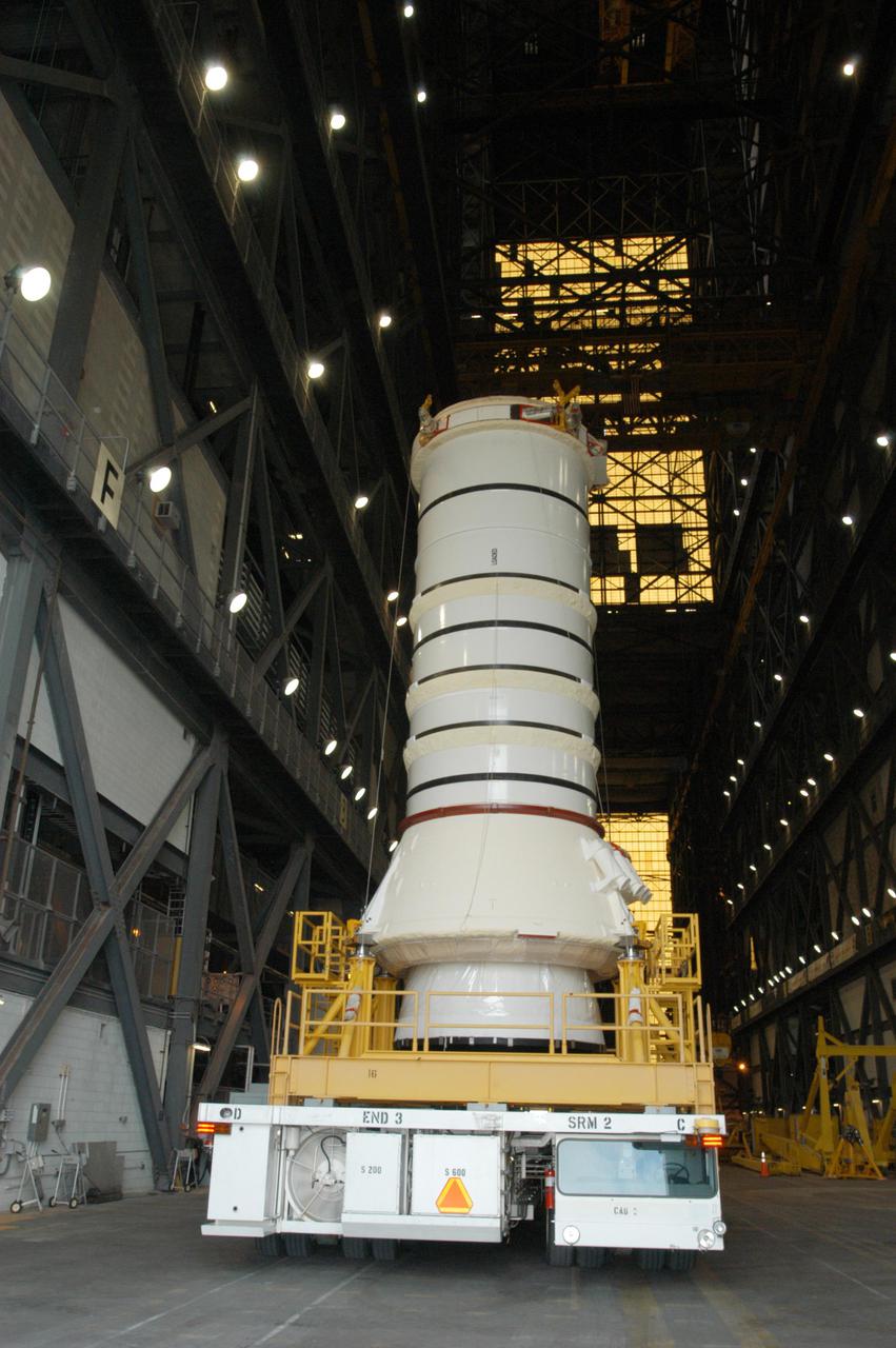 KENNEDY SPACE CENTER, FLA. -   The aft skirt and lower segment of the Solid Rocket Booster (SRB) being prepared for Return to Flight on mission STS-114 arrive inside the Vehicle Assembly Building.  The segments will be prepared for stacking with the other segments arriving later. Two SRBs support the liftoff of the Space Shuttle on a launch.  The twin 149-foot tall, 12-foot diameter SRBs provide the main propulsion system during launch to place the 180,000-pound orbiters in the proper orbit around the Earth.  They operate parallel with the Space Shuttle main engines for the first two minutes of flight and jettison away from the orbiter with help from the Booster Separation Motors, about 26.3 nautical miles above the Earth’s surface.