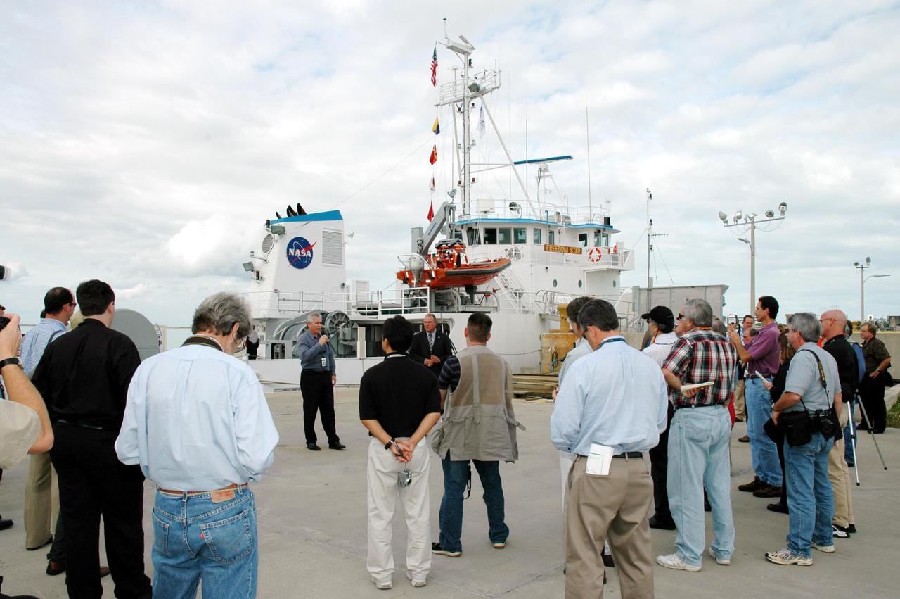 KENNEDY SPACE CENTER, FLA. -  The media visit the docks where Solid Rocket Booster (SRB) retrieval ships are stationed.  The stop was part of a day-long event that featured the movement of the first SRB segments to the Vehicle Assembly Building for stacking for Return to Flight mission STS-114. Two SRBs support the liftoff of the Space Shuttle on a launch.  The twin 149-foot tall, 12-foot diameter SRBs provide the main propulsion system during launch to place the orbiters in the proper orbit around the Earth.  They operate parallel with the Space Shuttle main engines for the first two minutes of flight and jettison away from the orbiter, with help from the Booster Separation Motors, about 26.3 nautical miles above the Earth’s surface.