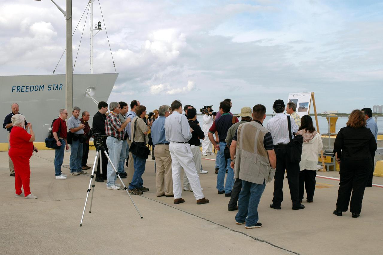 KENNEDY SPACE CENTER, FLA. -  On the deck of the Freedom Star, one of the Solid Rocket Booster (SRB) retrieval ships, the media learn about retrieval operations.  The stop was part of a day-long event that featured the movement of the first SRB segments to the Vehicle Assembly Building for stacking for Return to Flight mission STS-114. Two SRBs support the liftoff of the Space Shuttle on a launch.  The twin 149-foot tall, 12-foot diameter SRBs provide the main propulsion system during launch to place the orbiters in the proper orbit around the Earth.  They operate parallel with the Space Shuttle main engines for the first two minutes of flight and jettison away from the orbiter, with help from the Booster Separation Motors, about 26.3 nautical miles above the Earth’s surface.