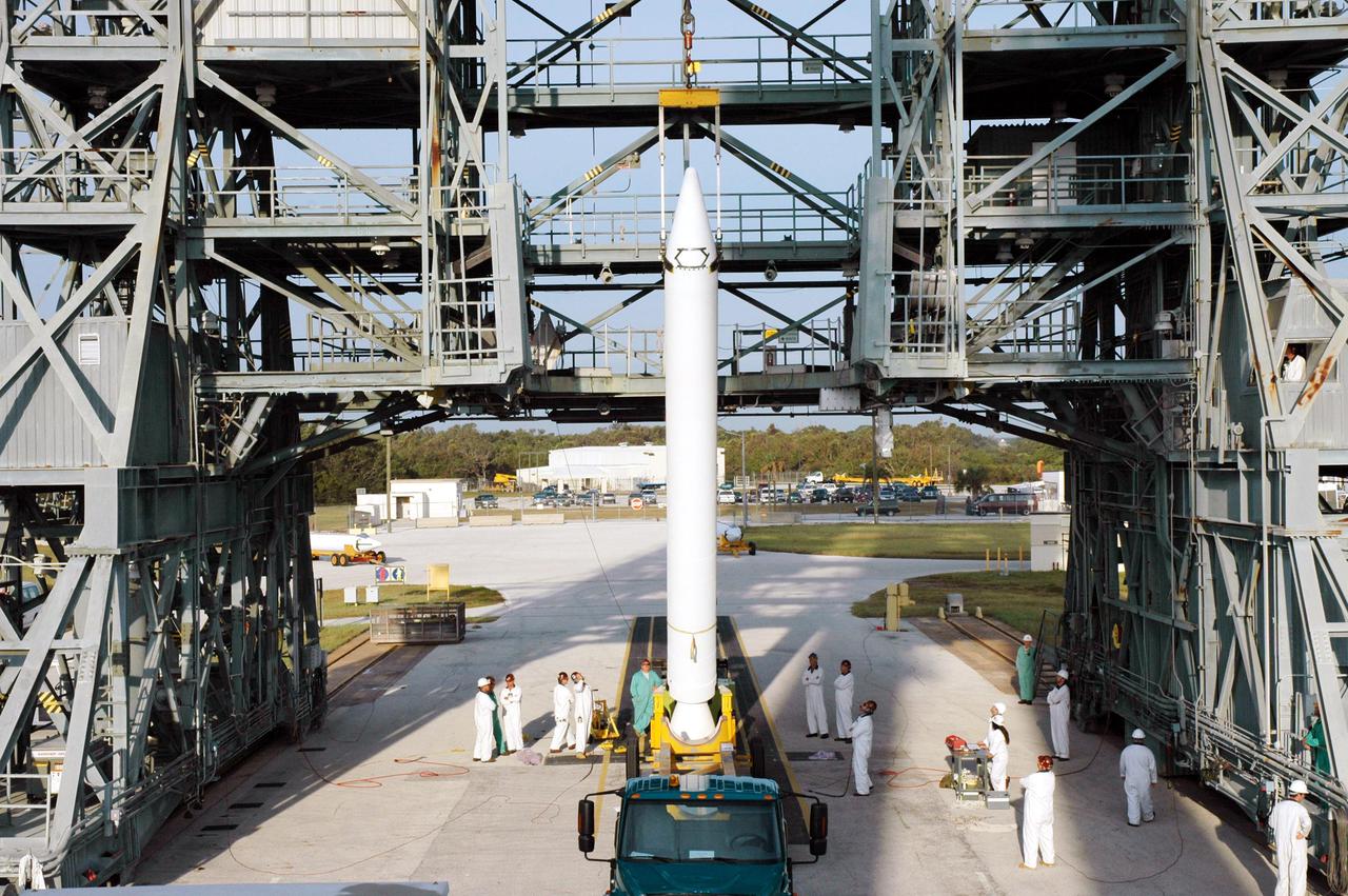 KENNEDY SPACE CENTER, FLA. - On Launch Pad 17-B, Cape Canaveral Air Force Station, Fla., a Solid Rocket Booster (SRB) is ready to be lifted up the mobile service tower and attached to the Boeing Delta II launch vehicle for launch of the Deep Impact spacecraft. A NASA Discovery mission, Deep Impact will probe beneath the surface of Comet Tempel 1 on July 4, 2005, when the comet is 83 million miles from Earth, and reveal the secrets of its interior. After releasing a 3- by 3-foot projectile to crash onto the surface, Deep Impact’s flyby spacecraft will collect pictures and data of how the crater forms, measuring the crater’s depth and diameter, as well as the composition of the interior of the crater and any material thrown out, and determining the changes in natural outgassing produced by the impact. It will send the data back to Earth through the antennas of the Deep Space Network. Deep Impact project management is handled by the Jet Propulsion Laboratory in Pasadena, Calif. The spacecraft is scheduled to launch Dec. 30, 2004.