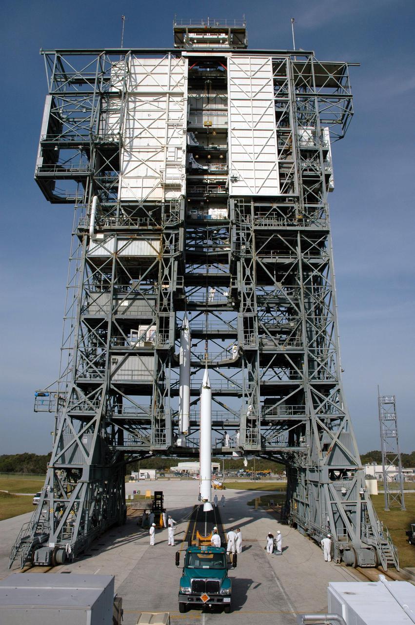 KENNEDY SPACE CENTER, FLA. - On Launch Pad 17-B, Cape Canaveral Air Force Station, Fla., another Solid Rocket Booster (SRB) is ready to be lifted up the mobile service tower and attached to the Boeing Delta II launch vehicle for launch of the Deep Impact spacecraft. A NASA Discovery mission, Deep Impact will probe beneath the surface of Comet Tempel 1 on July 4, 2005, when the comet is 83 million miles from Earth, and reveal the secrets of its interior. After releasing a 3- by 3-foot projectile to crash onto the surface, Deep Impact’s flyby spacecraft will collect pictures and data of how the crater forms, measuring the crater’s depth and diameter, as well as the composition of the interior of the crater and any material thrown out, and determining the changes in natural outgassing produced by the impact. It will send the data back to Earth through the antennas of the Deep Space Network. Deep Impact project management is handled by the Jet Propulsion Laboratory in Pasadena, Calif. The spacecraft is scheduled to launch Dec. 30, 2004.