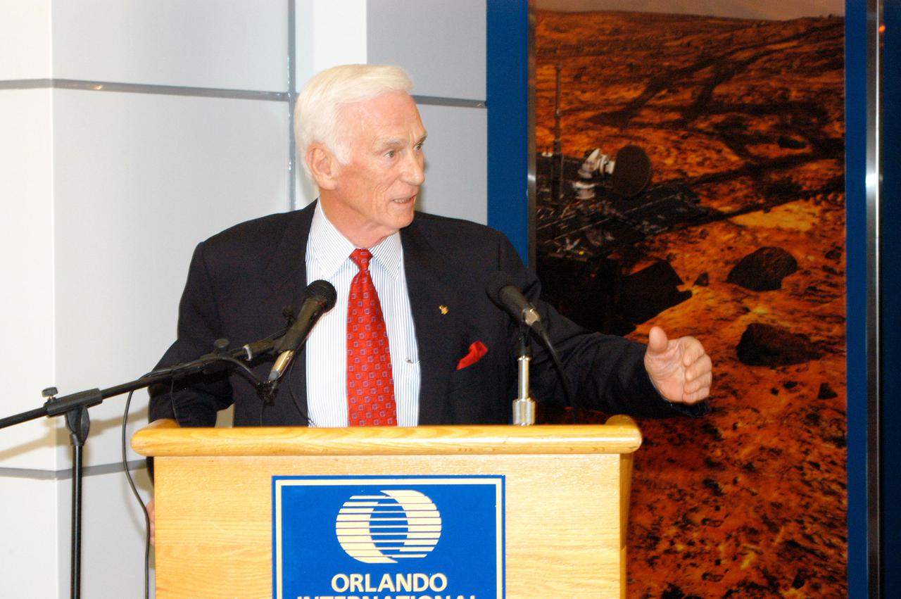 KENNEDY SPACE CENTER, FLA. -  Apollo 17 Commander Gene Cernan holds the attention of guests at the grand opening ceremony of the new Kennedy Space Center Store at Orlando International Airport.  The store will help educate millions of airport visitors about America’s space program and the Vision for Space Exploration.  The store is operated by Kennedy Space Center Visitor Complex concessionaire Delaware North Parks and Resorts.