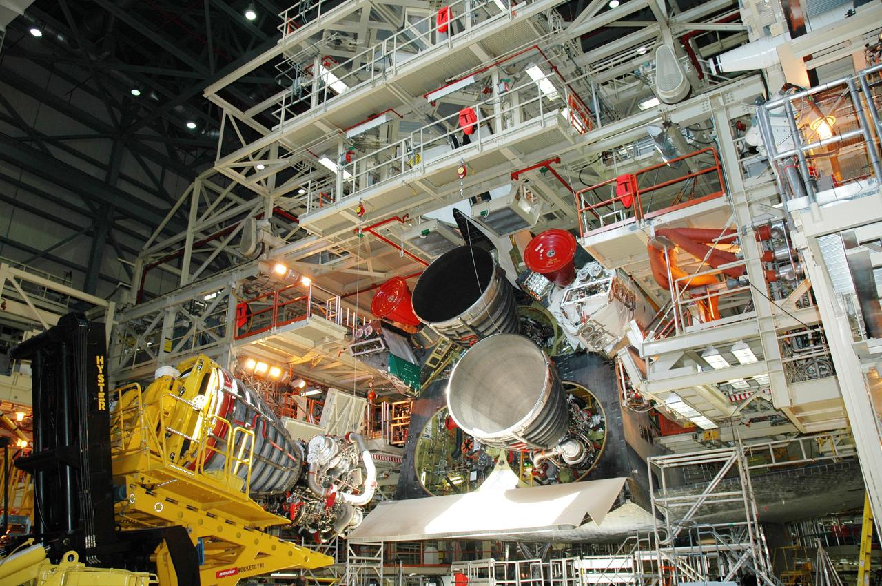 KENNEDY SPACE CENTER, FLA. - The third Space Shuttle Main Engine (SSME) arrives in the Orbiter Processing Facility for installation on Discovery. Discovery is designated as the Return to Flight vehicle for mission STS-114. Recent improvements to the SSME include the introduction of redesigned high-pressure turbopumps into the SSME fleet. The new pumps are designed and built by Pratt and Whitney at West Palm Beach, Fla. SSMEs and the Pratt and Whitney turbopumps are tested at Stennis Space Center in Mississippi. Engines and engine components are delivered to Kennedy Space Center to be prepared for flight.