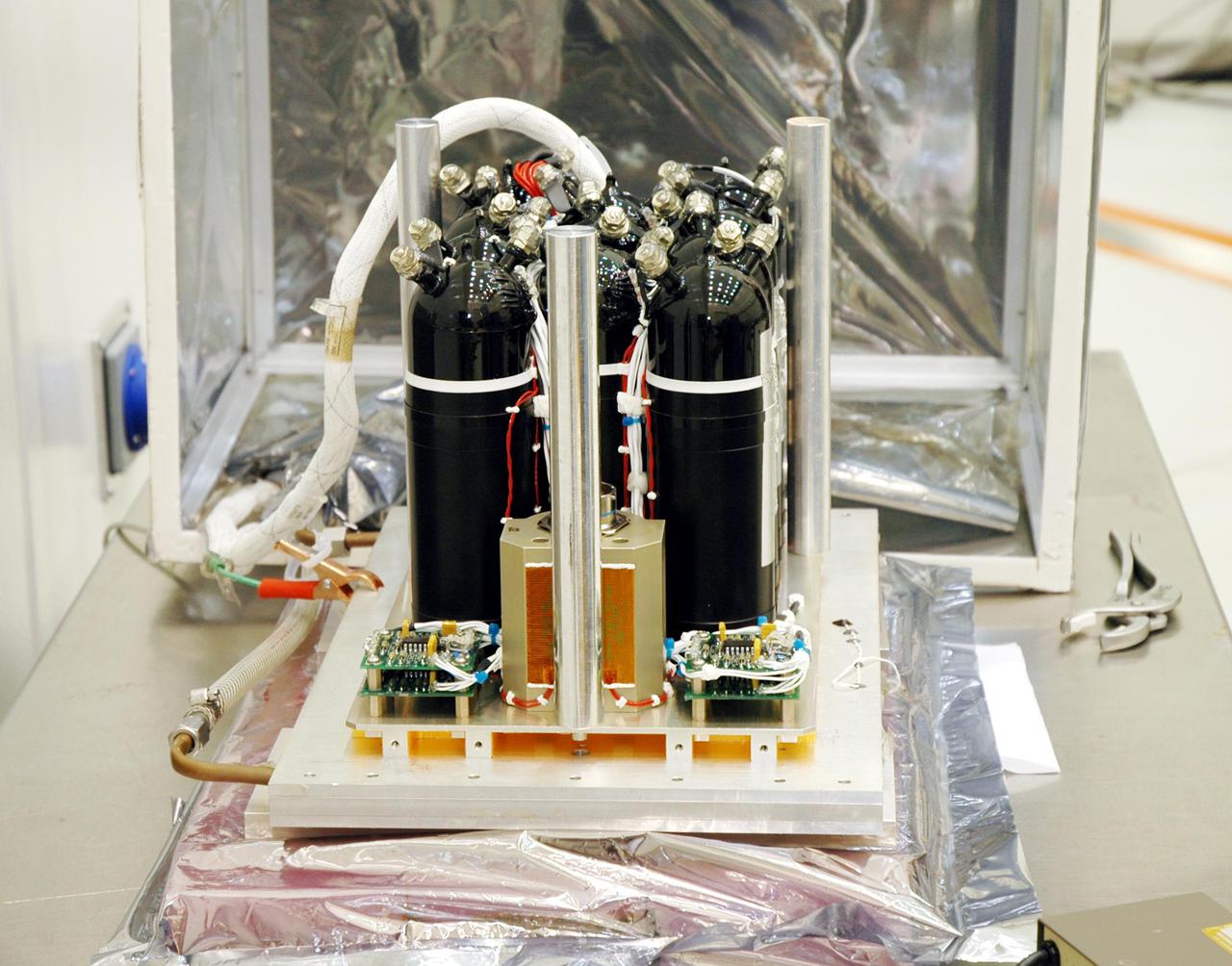 KENNEDY SPACE CENTER, FLA. - The flight battery for the Deep Impact flyby spacecraft awaits installation at Astrotech Space Operations in Titusville, Fla. About the size of a Ford Explorer, the flyby spacecraft is three-axis stabilized and uses a fixed solar array and a small NiH2 battery for its power system. A NASA Discovery mission, Deep Impact will probe beneath the surface of Comet Tempel 1 on July 4, 2005, when the comet is 83 million miles from Earth. During the encounter phase when the comet collides with the impactor projectile propelled into its path, the spacecraft’s high-gain antenna will transmit near-real-time images of the impact back to Earth. The spacecraft is scheduled to launch Jan. 8 aboard a Boeing Delta II rocket from Launch Complex 17-B at Cape Canaveral Air Force Station, Fla.