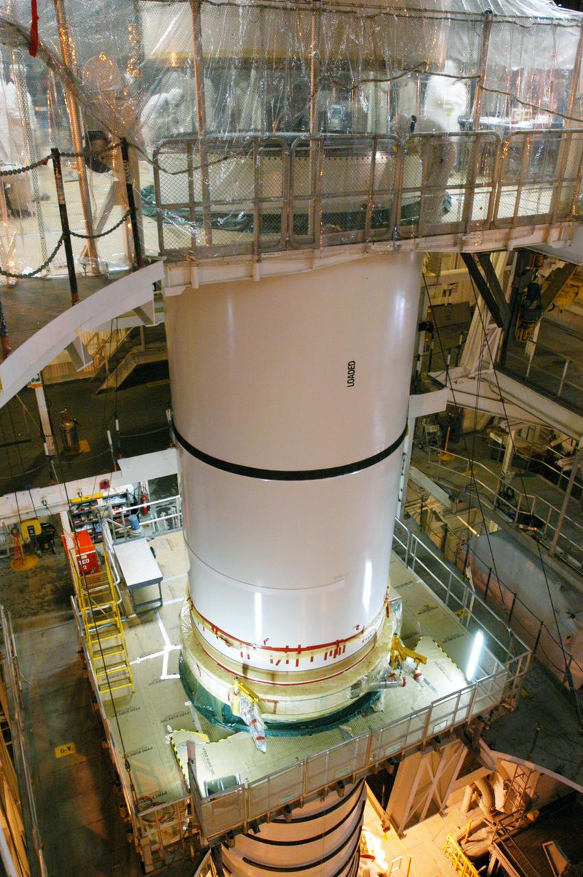 KENNEDY SPACE CENTER, FLA. -  In the Vehicle Assembly Building, the starboard Solid Rocket Booster is being stacked for Return to Flight mission STS-114 on Space Shuttle Discovery to the International Space Station.  Discovery is scheduled for a launch planning window of May 12 to June 3, 2005.