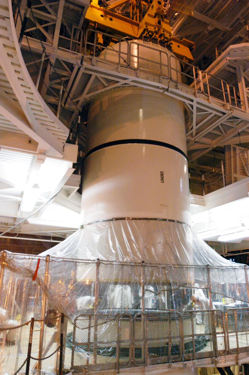 KENNEDY SPACE CENTER, FLA. -  In the Vehicle Assembly Building, the starboard Solid Rocket Booster is being stacked for Return to Flight mission STS-114 on Space Shuttle Discovery to the International Space Station.  Discovery is scheduled for a launch planning window of May 12 to June 3, 2005.