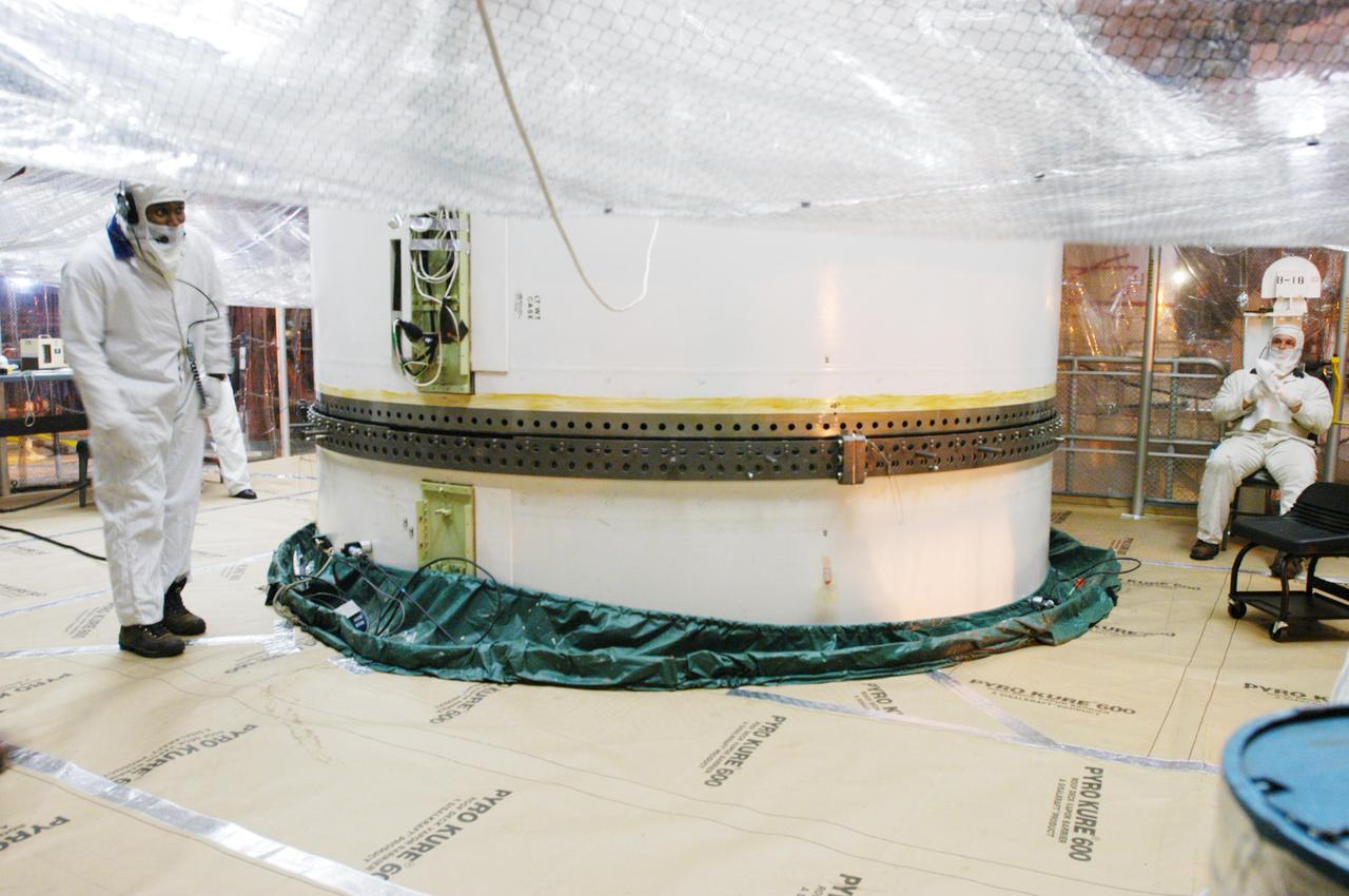 KENNEDY SPACE CENTER, FLA. -  In the Vehicle Assembly Building, the mating of upper and lower segments of the starboard Solid Rocket Booster is complete.  The SRB is being stacked for Return to Flight mission STS-114 on Space Shuttle Discovery to the International Space Station.  Discovery is scheduled for a launch planning window of May 12 to June 3, 2005.