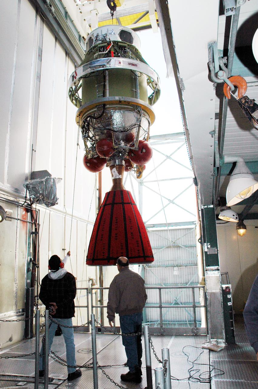 KENNEDY SPACE CENTER, FLA. -  In the mobile service tower on Pad 17-B, Cape Canaveral Air Force Station, Fla., the second stage of the Boeing Delta II rocket is moved toward the front after demating from the inter-stage adapter. Removal of the second stage will allow workers to then remove the rocket’s inter-stage adapter, which was found to be faulty during a review of launch vehicle hardware.  It will be replaced and the second stage re-installed within a few days.  Launch of Deep Impact is now scheduled no earlier than Jan. 12.