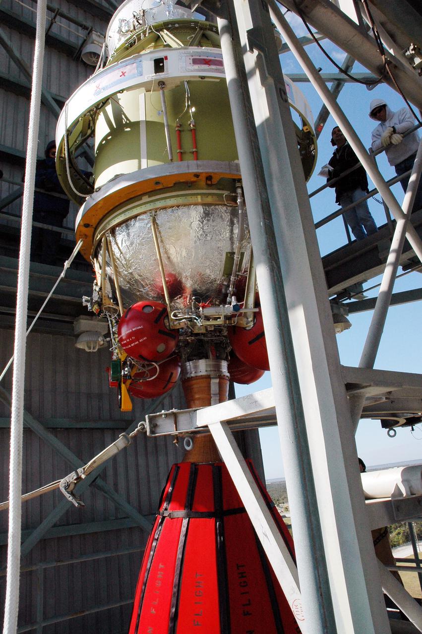 KENNEDY SPACE CENTER, FLA. -  In the mobile service tower on Pad 17-B, Cape Canaveral Air Force Station, Fla., the second stage of the Boeing Delta II rocket is moved toward the front after demating from the inter-stage adapter. Removal of the second stage will allow workers to then remove the rocket’s inter-stage adapter, which was found to be faulty during a review of launch vehicle hardware.  It will be replaced and the second stage re-installed within a few days.  Launch of Deep Impact is now scheduled no earlier than Jan. 12.