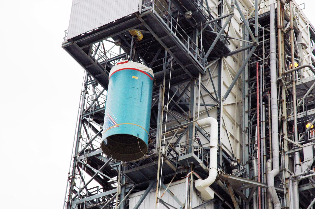 KENNEDY SPACE CENTER, FLA. -  On Pad 17-B, Cape Canaveral Air Force Station , Fla., Boeing Delta II interstage adapter is seen being lowered toward the pad. The interstage adapter was found to be faulty during a review of launch vehicle hardware.  It will be replaced, and the second stage previously removed will be re-installed within a few days.  Launch of Deep Impact is now scheduled no earlier than Jan. 12.