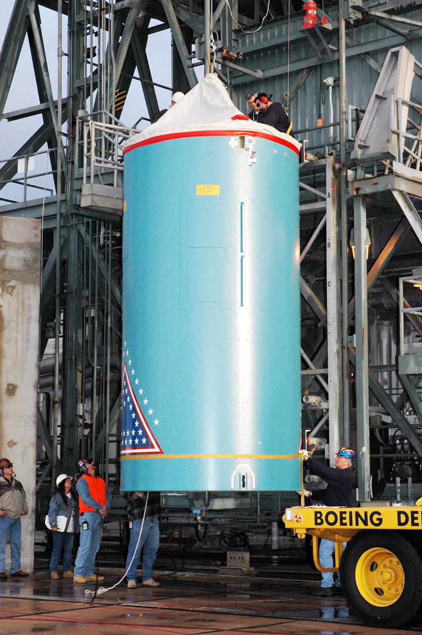 KENNEDY SPACE CENTER, FLA. -  The replacement interstage adapter for the Boeing Delta II launch vehicle for the Deep Impact spacecraft is ready to be lifted up the mobile service tower on Launch Pad 17-B, Cape Canaveral Air Force Station, Fla.   Boeing workers will attach the adapter to the rocket’s center body section.  Later the second stage, which was removed to allow access to the previous adapter, will be reattached. The first adapter was removed after it was found to be faulty during a review of launch vehicle hardware. Launch of Deep Impact is now scheduled no earlier than Jan. 12.