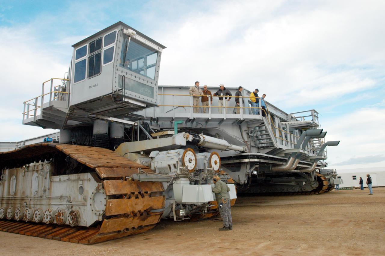 KENNEDY SPACE CENTER, FLA. -  The newly shod Crawler Transporter is checked out before beginning a road test. The Crawler Transporter that will move Space Shuttle Discovery to the launch pad for Return to Flight is taking its first road test following the replacement of all its shoes. The crawlers have 456 shoes, 57 per belt (8 belts in all). Each shoe weighs 2,200 pounds. Cracks appeared in the shoes in recent years, spurring a need for replacement. The new manufacturer, in Duluth, Minn., has improved the design for a safe Return to Flight and use through the balance of the Space Shuttle Program.