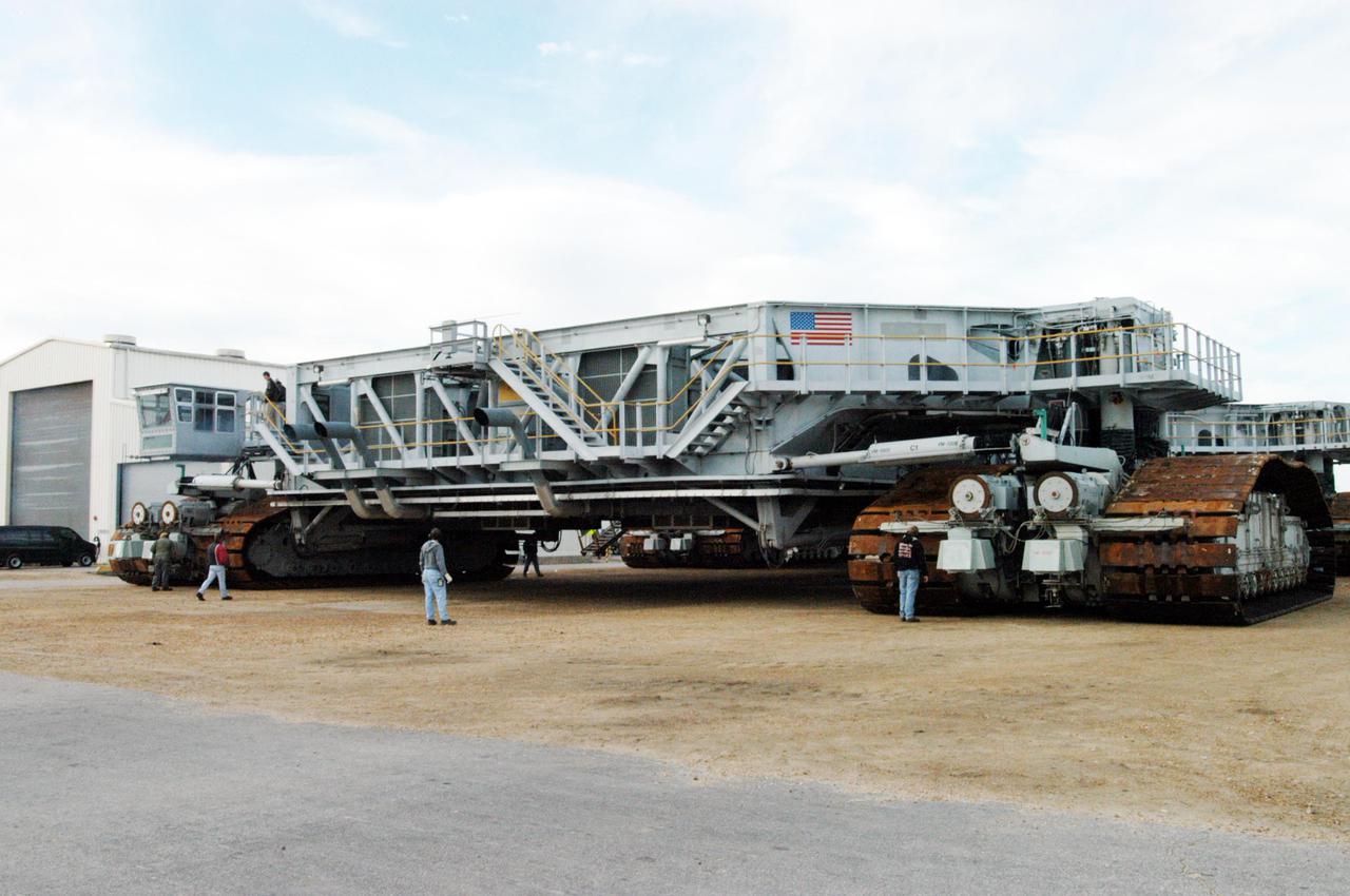 KENNEDY SPACE CENTER, FLA. - The newly shod Crawler Transporter is checked out before beginning its road test. The Crawler Transporter that will move Space Shuttle Discovery to the launch pad for Return to Flight is taking its first road test following the replacement of all its shoes. The crawlers have 456 shoes, 57 per belt (8 belts in all). Each shoe weighs 2,200 pounds. Cracks appeared in the shoes in recent years, spurring a need for replacement. The new manufacturer, in Duluth, Minn., has improved the design for a safe Return to Flight and use through the balance of the Space Shuttle Program.