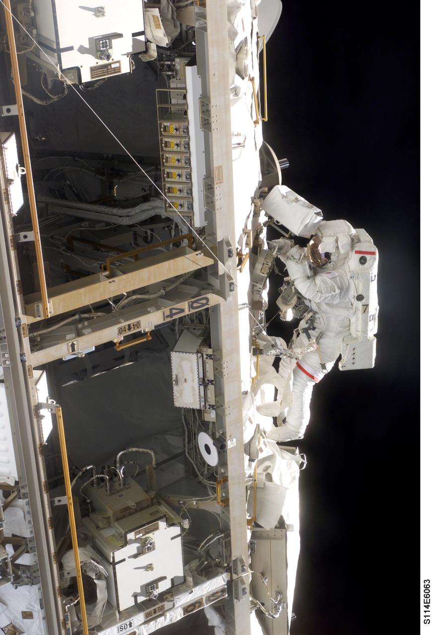 Launched on July 26, 2005 from the Kennedy Space Center in Florida, STS-114 was classified as Logistics Flight 1. Among the Station-related activities of the mission were the delivery of new supplies and the replacement of one of the orbital outpost's Control Moment Gyroscopes (CMGs). STS-114 also carried the Raffaello Multi-Purpose Logistics Module (MPLM) and the External Stowage Platform-2. In this photograph, astronaut Soichi Noguchi, STS-114 mission specialist representing the Japan Aerospace Exploration Agency (JAXA), participates in the mission’s first scheduled session of Extra Vehicular Activity (EVA). Noguchi and crew mate Stephen K. Robinson (out of frame) completed a demonstration of Shuttle thermal protection repair techniques and enhancements to the ISS’s attitude control system during the successful 6 hour, 50 minute space walk.