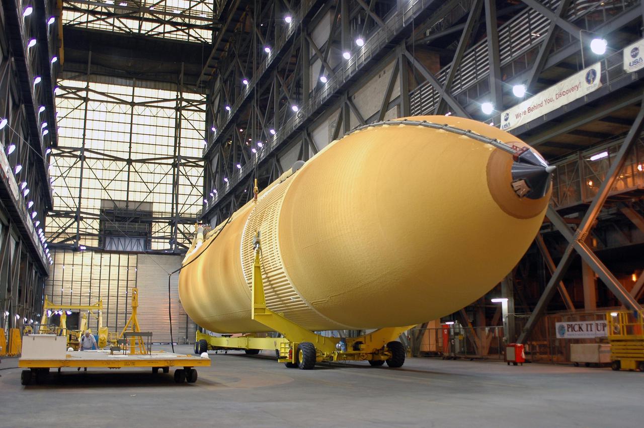 KENNEDY SPACE CENTER, FLA. - The redesigned External Tank is ready to be raised to a vertical position and lifted into the 'checkout cell' of the Vehicle Assembly Building where the tank’s mechanical, electrical and thermal protection systems are inspected. The tank will also undergo new processes resulting from its redesign, including inspection of the bipod heater and External Tank separation camera. The tank will be prepared for 'mating' to the Shuttle’s Solid Rocket Boosters. When preparations are complete, the tank will be lifted from the checkout cell, moved across the transfer aisle and into High Bay 1. It will be lowered and attached to the boosters, which are sitting on the Mobile Launch Platform.  The SRBs and ET will be flying with Shuttle Discovery for the Return to Flight mission STS-114.  The launch planning window is May 12 to June 3, 2005.