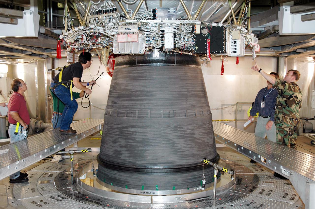 KENNEDY SPACE CENTER, FLA. - At the Delta Operations Center on Cape Canaveral Air Force Station, Fla., workers prepare for the Boeing Delta IV second stage nozzle extension test. The Delta IV is the launch vehicle for GOES-N satellite. Geostationary Operational Environmental Satellites (GOES) are sponsored by the National Aeronautics and Space Administration (NASA) and the National Oceanic and Atmospheric Administration (NOAA). GOES-N is the first in the next series of GOES satellites, N-P. The multi-mission GOES series N-P will be a vital contributor to weather, solar and space operations and science. The GOES N-P series will aid activities ranging from severe storm warnings to resource management and advances in science. GOES-N is scheduled to launch May 4 from Cape Canaveral Air Force Station, Fla.