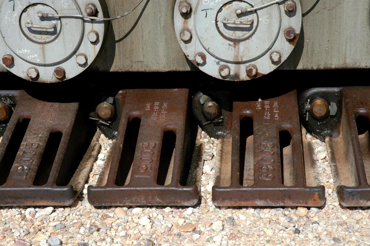 KENNEDY SPACE CENTER, FLA.  - New shoes adorn the Crawler Transporter that will move Space Shuttle Discovery to the launch pad for Return to Flight as it demonstrates its readiness for weight bearing by moving an unloaded 8,230,000-pound Mobile Launch Platform along the crawlerway. Its first road test on Jan. 21, following the replacement of all its shoes, was a success. Cracks appeared in the crawlers' shoes in recent years, spurring a need for replacement. The new manufacturer, in Duluth, Minn., has improved the design for a safe Return to Flight and use through the balance of the Space Shuttle Program. Each crawler has 456 shoes, 57 per belt (8 belts in all). Each shoe weighs 2,200 pounds.